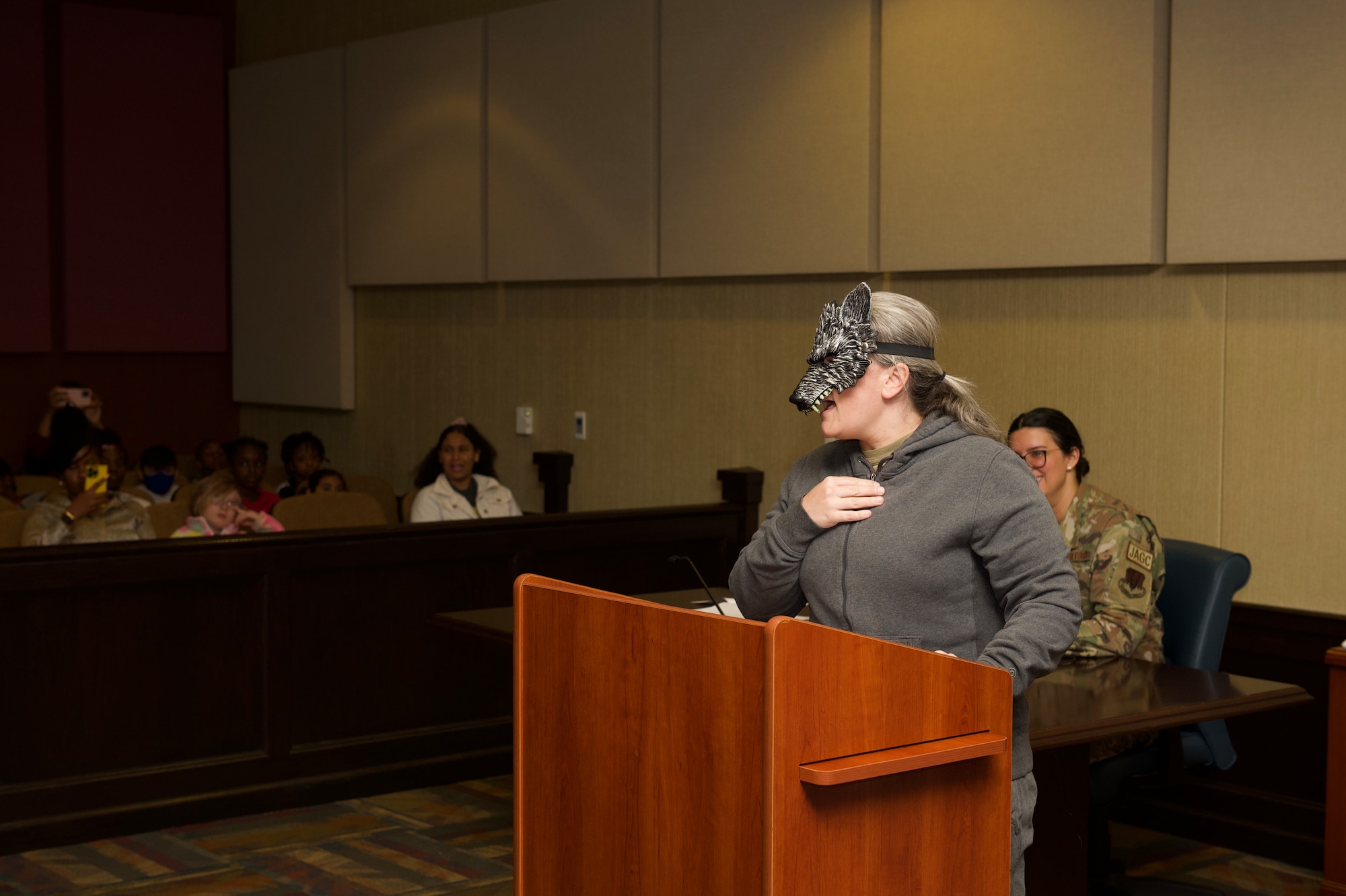 Master Sgt. Mary Staats-Walker, 4th Fighter Wing Judge Advocate law office superintendent, portrays the Big Bad Wolf, while giving an unsworn statement to a mock jury consisting of students from Carver Heights Elementary School, Goldsboro, North Carolina, during a fairy tale themed mock trial at Seymour Johnson Air Force Base, North Carolina, May 1, 2023. An unsworn statement is when someone shares their side of a story while not under oath. The base invited the students as part of Law Day to teach them about the Air Force’s legal professions. Community outreach events help the wing build relations with local communities and is an opportunity for Airmen to mentor future leaders. (U.S. Air Force photo by Airman 1st Class Rebecca Sirimarco-Lang)