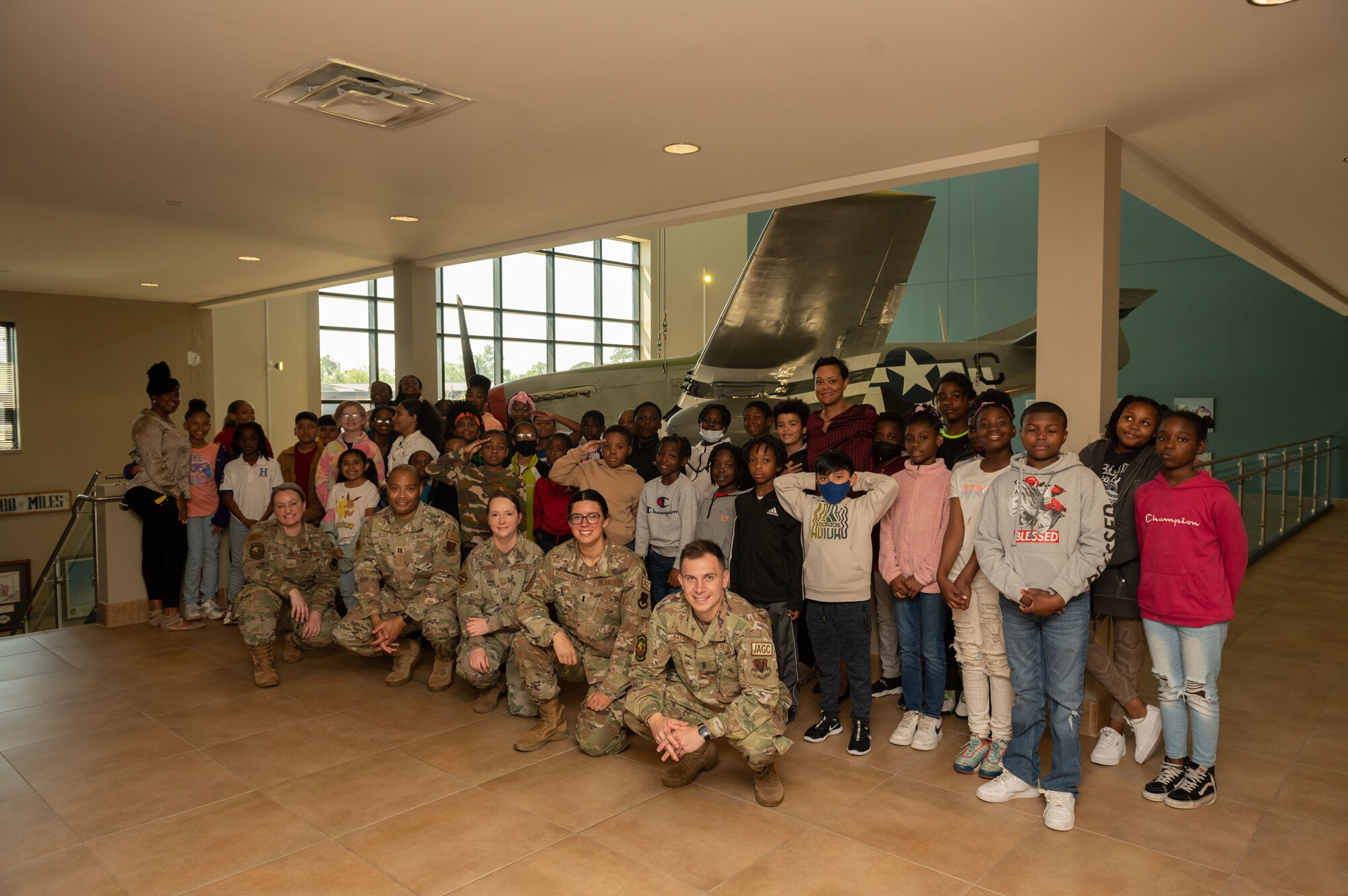 Airmen assigned to the 4th Fighter Wing Judge Advocate Office, children and teachers from Carver Heights Elementary School, Goldsboro, North Carolina, pose for photo after completing a “Big Bad Wolf” fairy tale themed mock trial as part of Law Day at Seymour Johnson Air Force Base, North Carolina, May 1, 2023. The event was held as a part of Law Day to help teach children about Air Force’s legal profession. Community outreach events help the wing build relations with local communities and is an opportunity for Airmen to mentor future leaders.  (U.S. Air Force photo by Airman 1st Class Rebecca Sirimarco-Lang)