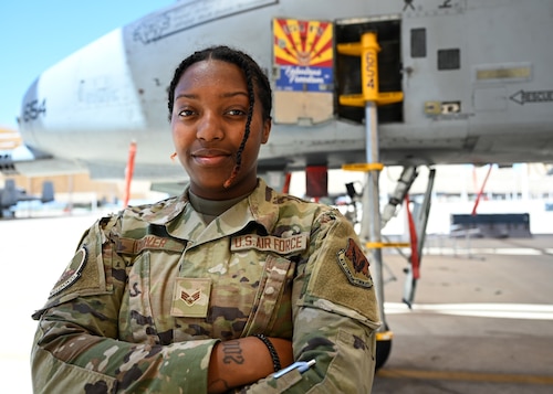 Senior Airman Gabrielle Glover, 354th Fighter Squadron all-source intelligence analyst, stands in front of an A-10C Thunderbolt II at Davis-Monthan Air Force Base, Ariz., April 25, 2023. An all-source intelligence analyst discovers, develops and evaluates intelligence to advise commanders on force protection and intelligence information for U.S. and partner nations. (U.S. Air Force photo by Staff Sgt. Abbey Rieves)