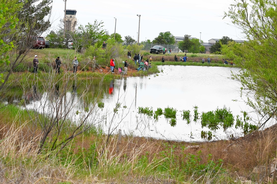 Airmen and family members participate in the 97th Civil Engineer Squadron environmental flight’s annual fishing derby held at Altus Air Force Base, Oklahoma, April 28, 2023. The fishing derby is an event to give base personnel the chance to get outside and fish while celebrating Earth Day. (U.S. Air Force photo by Airman 1st Class Heidi Bucins)