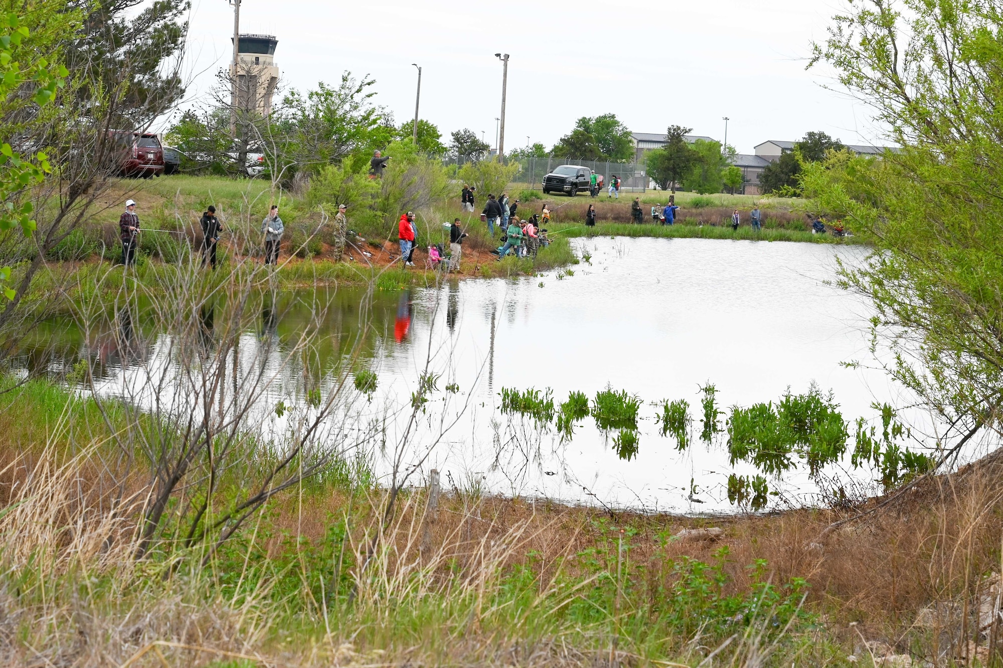 Airmen and family members participate in the 97th Civil Engineer Squadron environmental flight’s annual fishing derby held at Altus Air Force Base, Oklahoma, April 28, 2023. The fishing derby is an event to give base personnel the chance to get outside and fish while celebrating Earth Day. (U.S. Air Force photo by Airman 1st Class Heidi Bucins)