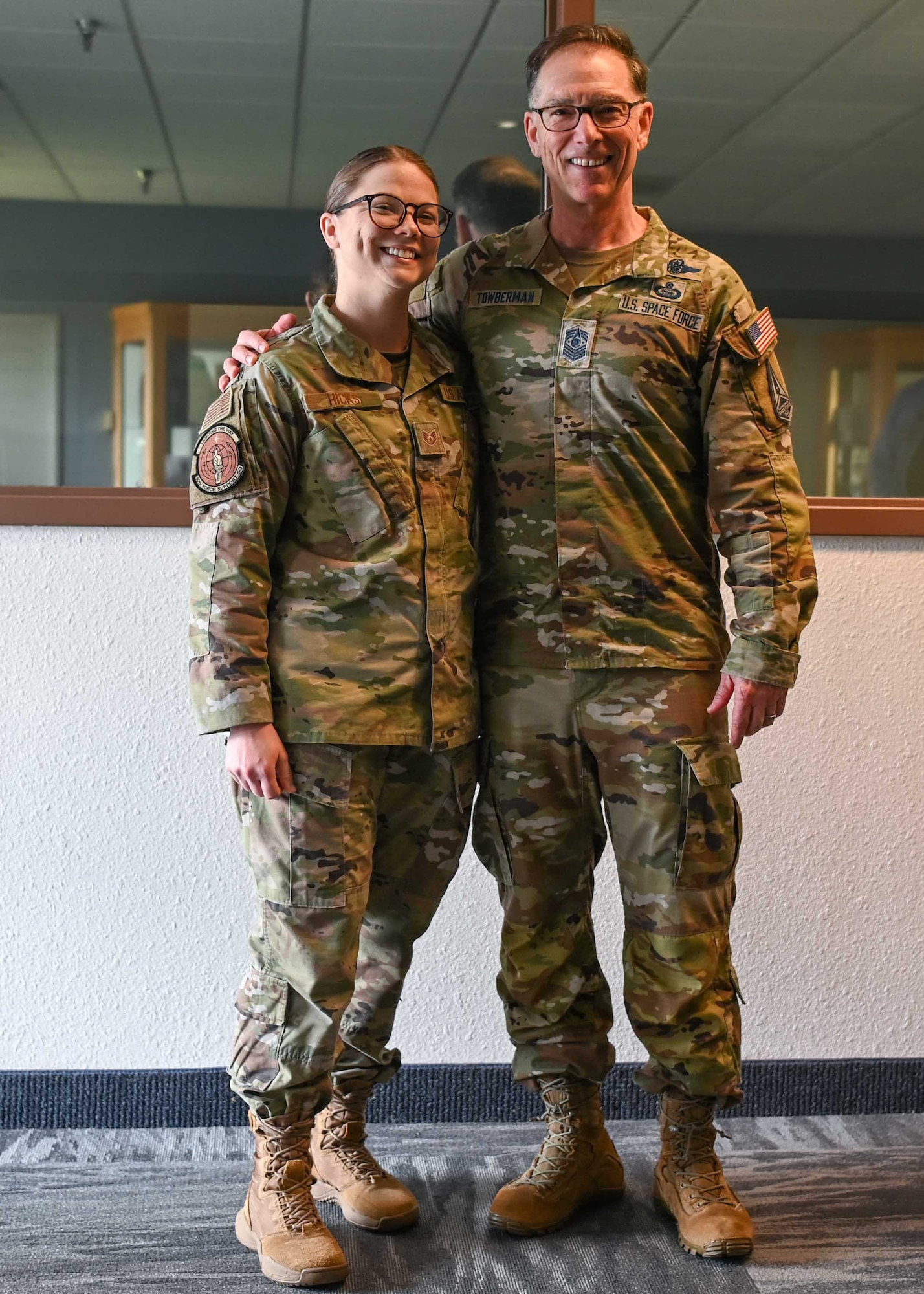 Chief Master Sgt. of the Space Force Roger A. Towberman and Staff Sgt. Emerald Hicks, 30th Force Support Squadron professional military education instructor, poses for a photo before speaking the Airman Leadership class 22-D at Vandenberg Space Force Base, Calif., May 2, 2023. Towberman spent his time with the Airmen and Guardians talking about his life in the Air Force and Space. (U.S. Space Force photo by Senior Airman Tiarra Sibley)