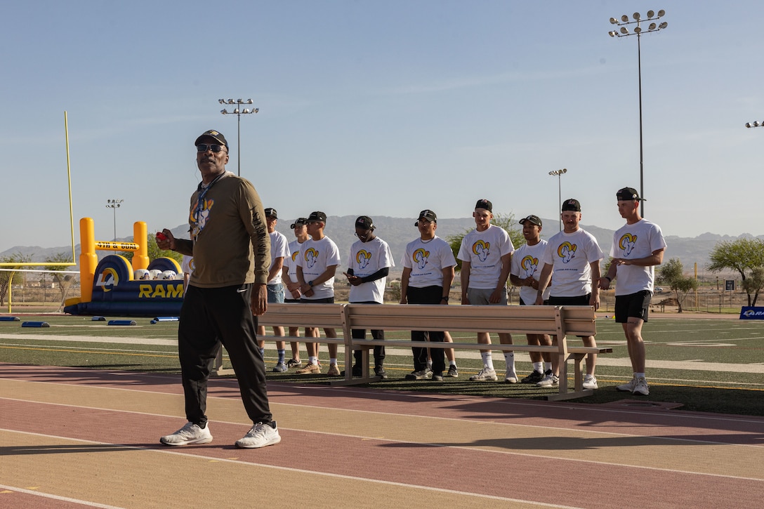 Los Angeles Rams speed and agility coach Mo Streety speaks to families during a Los Angeles Rams Performance Camp at Marine Corps Air Ground Combat Center