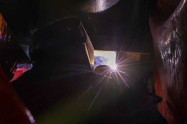 A Joint Task Force-Red Hill (JTF-RH) contractor welds a support beam during repairs in Halawa, Hawaii, April 25, 2023.