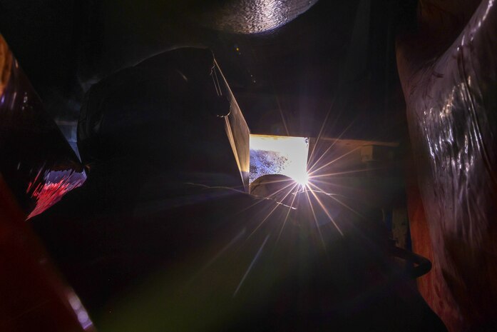 A Joint Task Force-Red Hill (JTF-RH) contractor welds a support beam during repairs in Halawa, Hawaii, April 25, 2023.