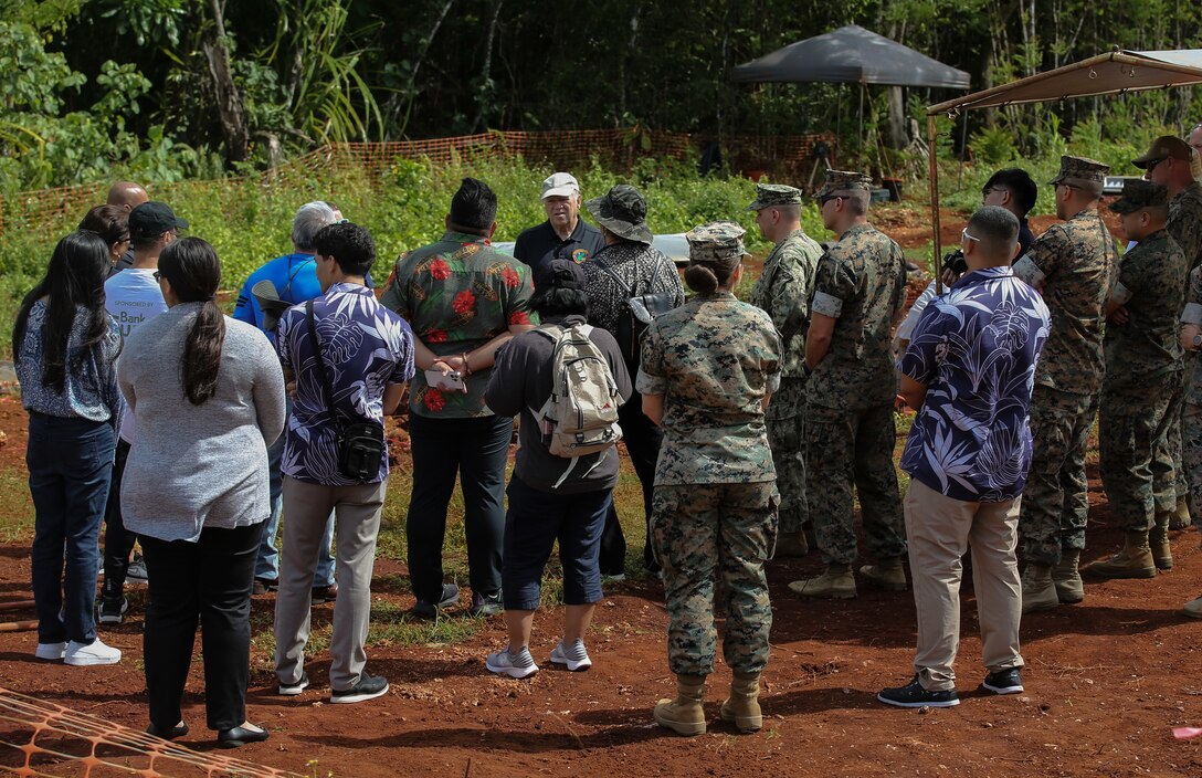 Ronnie Rogers, center, cultural resource manager for Marine Corps Base (MCB) Camp Blaz, briefs members and staff of the 37th Guam Legislature about MCB Camp Blaz's archeological process while on a tour at the Urban Training Complex, Yigo, Guam, March 17, 2023. MCB Camp Blaz coordinated with the Chairman for the Committee on the Guam Buildup, Senator Roy Quinata and his staff to invite all members of the Guam Legislature on a base tour to learn more about the Marine Corps' construction progress and to showcase the ongoing efforts to avoid, minimize, and offset the impact to Guam’s natural and cultural resources. (U.S. Marine Corps photo by Lance Cpl. Garrett Gillespie)
