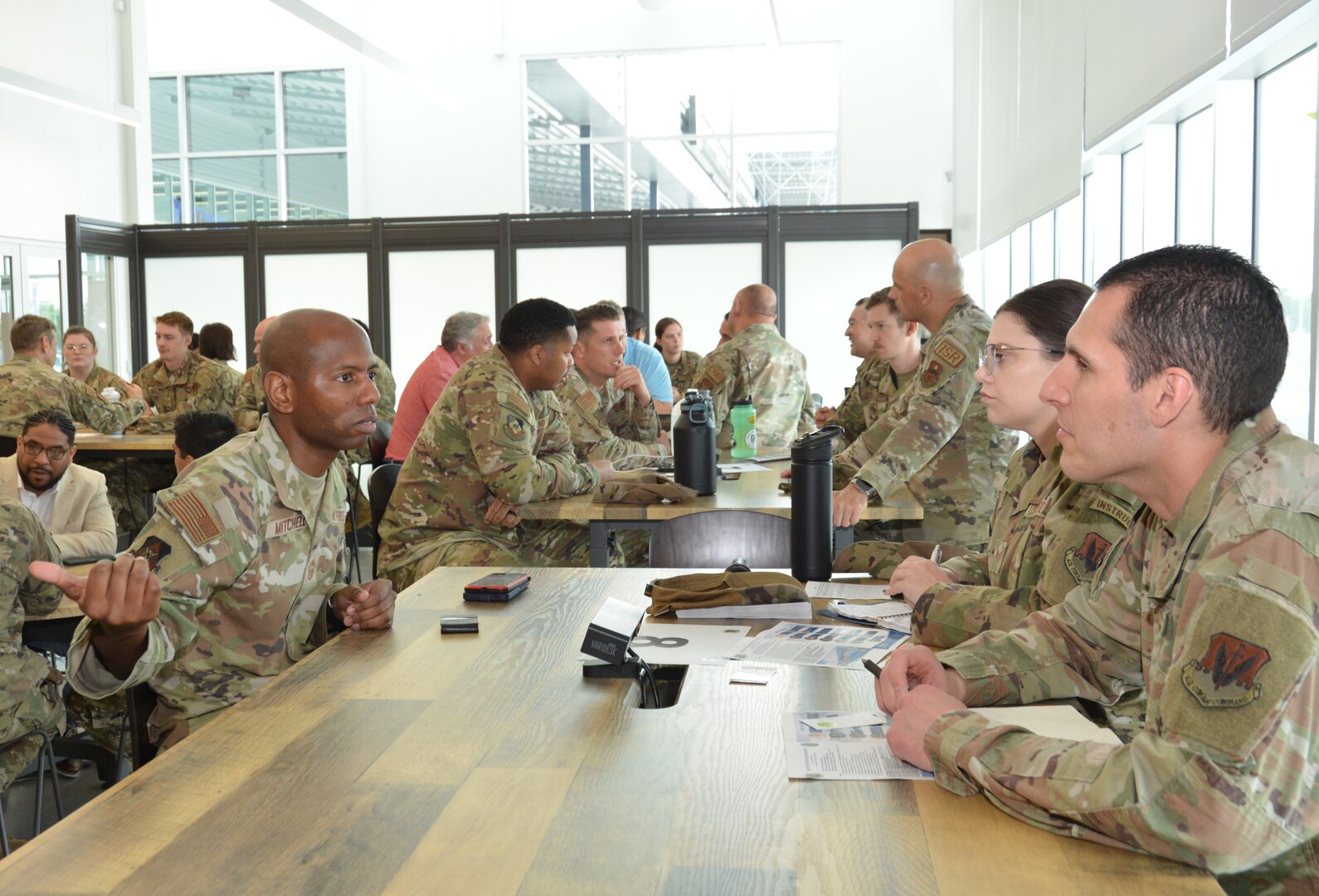 Chief Master Sgt. Brian Mitchell (left), 543rd Intelligence Squadron senior enlisted leader, discusses personal growth with junior Airmen during a speed-mentoring session, Friday, at Joint Base San Antonio-Kelly.