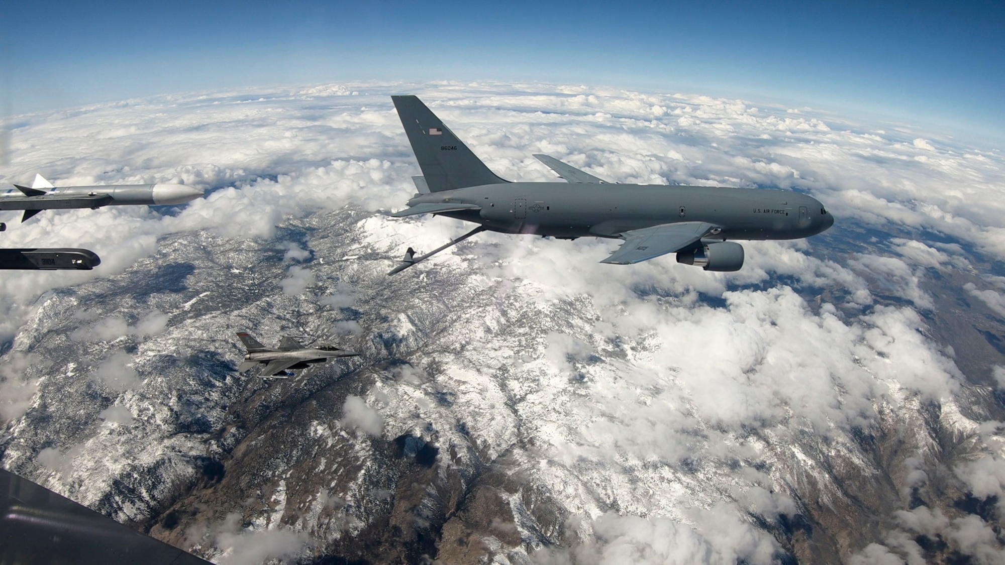 A KC-46 Pegasus conducts an air refueling test mission with a F-16 Fighting Falcon over the skies of Southern California. Operating a specialized boom from the back of a KC-46, In-flight Refueling Specialists pump thousands of gallons of jet fuel into aircraft in need of fuel.