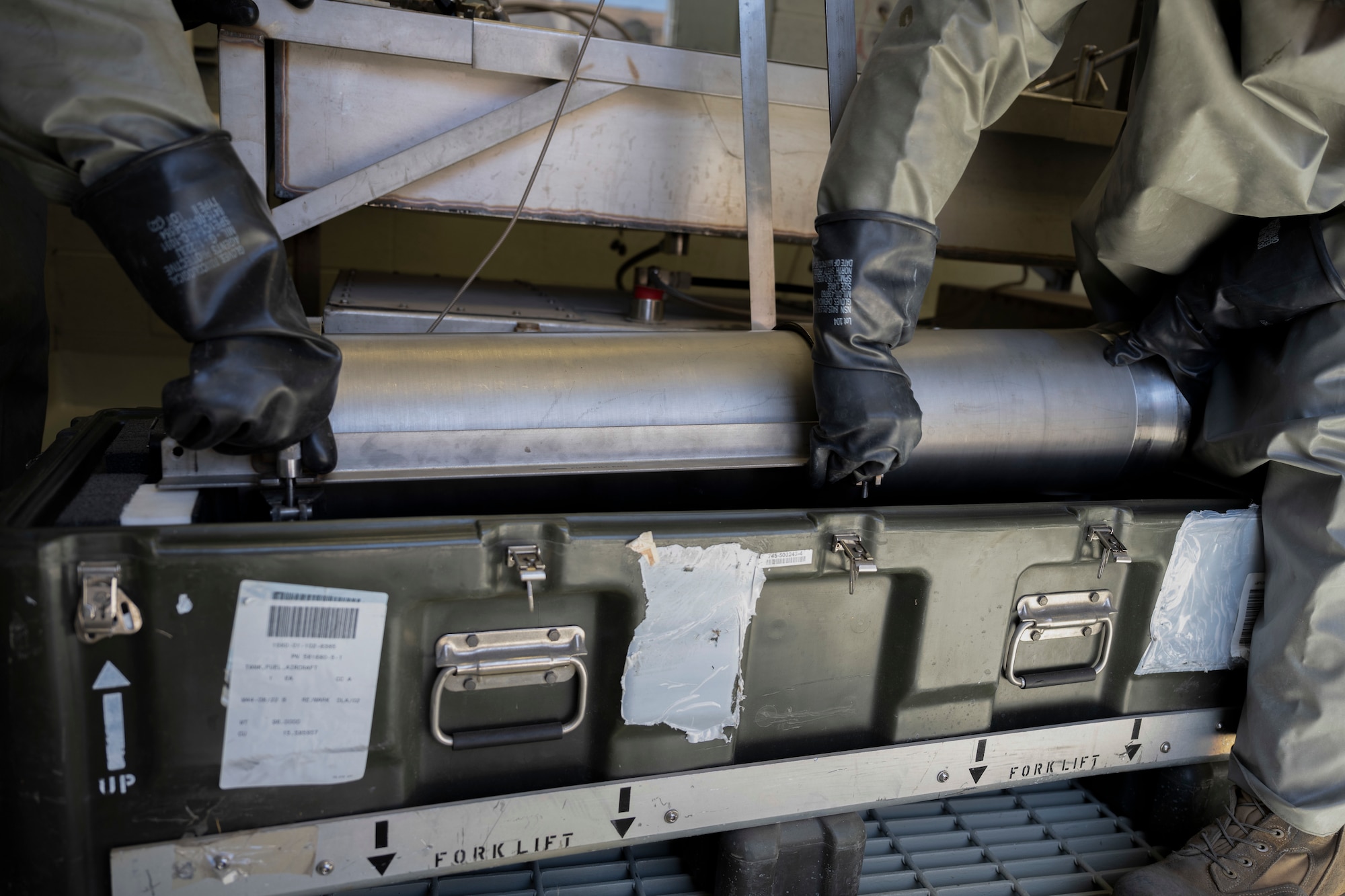 Airmen from 49th Component Maintenance Squadron transport a container of hydrazine at Holloman Air Force Base, New Mexico, April 18, 2023. The handling of hydrazine requires specialized vehicles and strict handling procedures to transport fuel for the F-16 jets to carry out training missions. (U.S. Air Force photo by Airman 1st Class Michelle Ferrari)