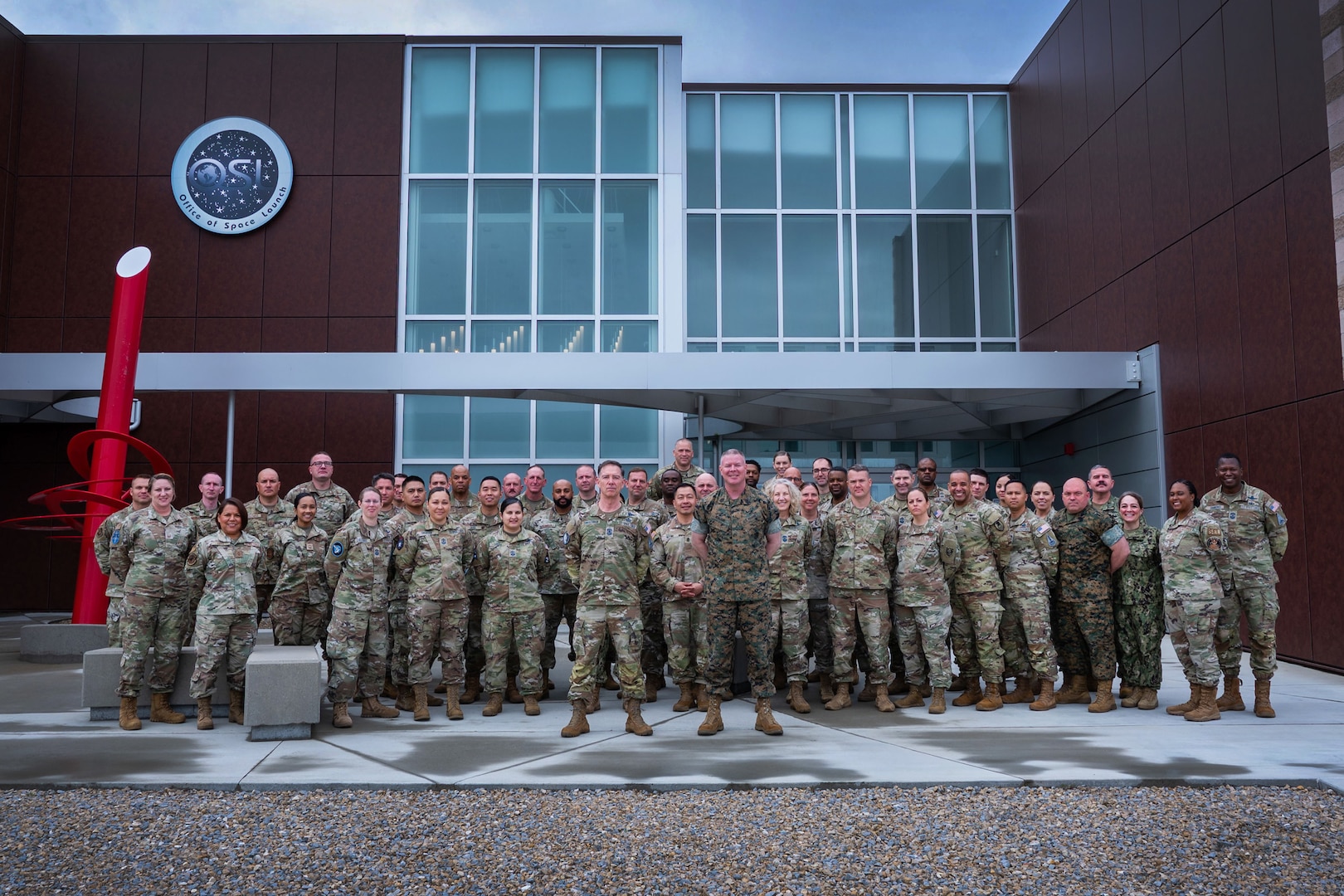 Chief Master Sgt. of the Space Force Roger A. Towberman, center-left, and U.S. Marine Corps Master Gunnery Sgt. Scott H. Stalker, U.S. Space Command command senior enlisted leader, center-right, stand with participants of a Command Senior Enlisted Leader (CSEL) event outside the National Reconnaissance Office's Office of Space Launch building at Vandenberg Space Force Base, Calif., May 2, 2023. The CSEL event spanned three days with over 45 senior enlisted members from space-affiliated units participating in tours of space facilities, leadership seminars and mission-focused briefings. (U.S. Space Force photo by Tech. Sgt. Luke Kitterman)