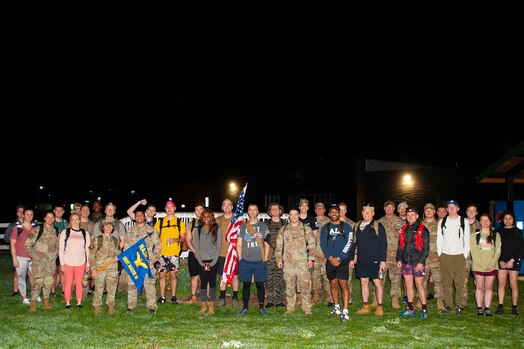  More than 30 civilian and military personnel from the National Air and Space Intelligence Center pose for a group photo before embarking on the Bataan Memorial Death March in Beavercreek, Ohio, April 14, 2023. Organized by U.S. Air Force Technical Sgt. Kyle Townshend and Senior Airman Nathaniel Tillman of NASIC, the ruck commemorates the combined 10,000 American and Filipino soldiers that died in the Bataan Death March, a forced 65-mile march during World War II in April of 1942.