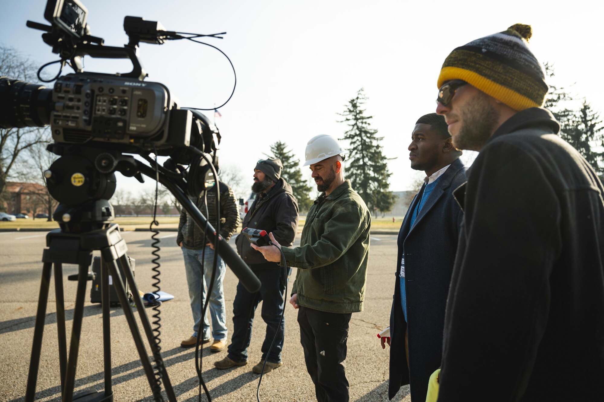 Ryan Law, foreground, Jeffery Harris and Chris Decker, all members of the 88th Air Base Wing Public Affairs video team, film a news story about jobs the 88th Air Base Wing Civil Engineering Group performs at Wright-Patterson Air Force Base. Public affairs spreads the word, preserves, and puts color, ink and audio to the wing, from Airmen’s everyday operations to the mission’s biggest moments. (U.S. Air Force photo by Hannah Carranza)