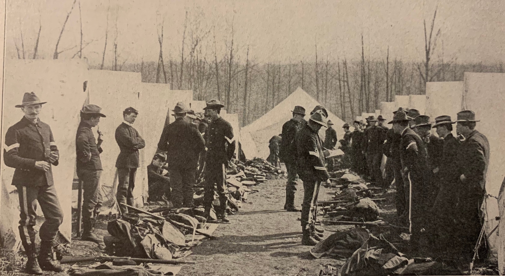 Soldiers from the National Guard of Pennsylvania congregate in a living area during the NGP's muster in Mount Gretna, Pennsylvania, in May 1898 for service in the Spanish-American War. (From "The Twenty-Eighth Division in the World War")