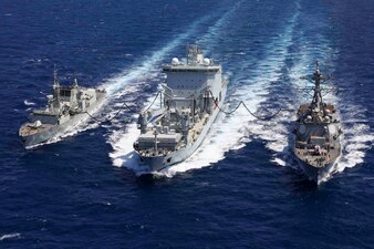 USS Truxtun (DDG 103), right, and the Royal Canadian Navy supply ship MV Asterix and the frigate HMCS Montreal (FFH 336) conduct a replenishment-at-sea in the Red Sea.