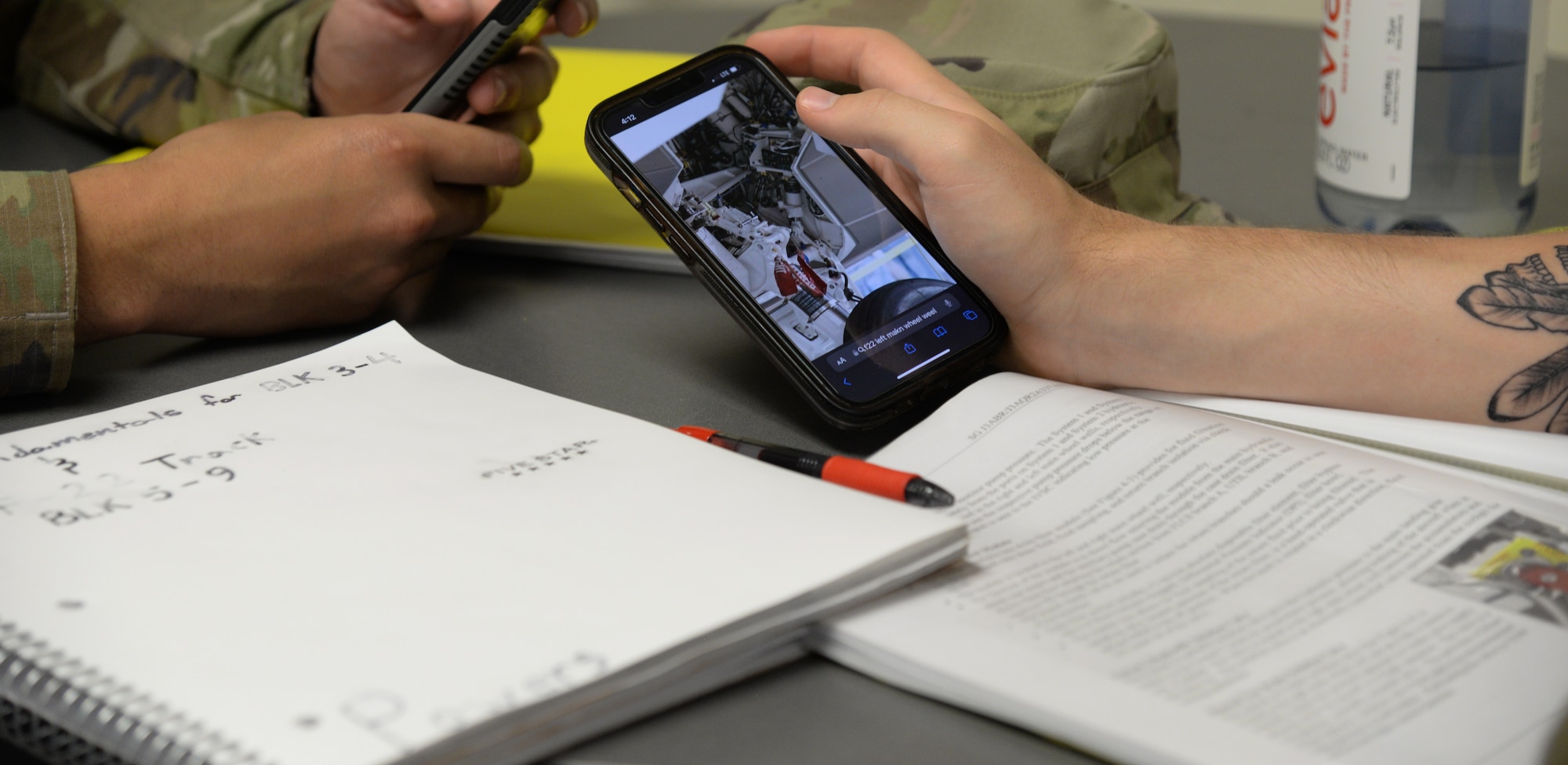 Airmen using personal devices to access a website