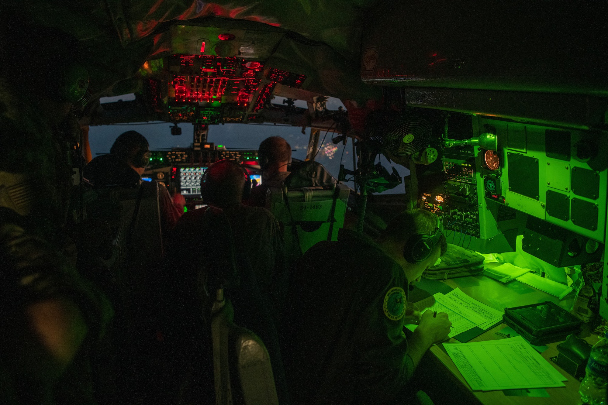 Airmen piloting and navigating a KC-135 Stratotanker assigned to the Ohio Air National Guard prepare for a night landing as part of Operation Hoodoo Sea over South Florida May 1, 2023. The exercise validated minimum force elements using multi-capable Airmen.