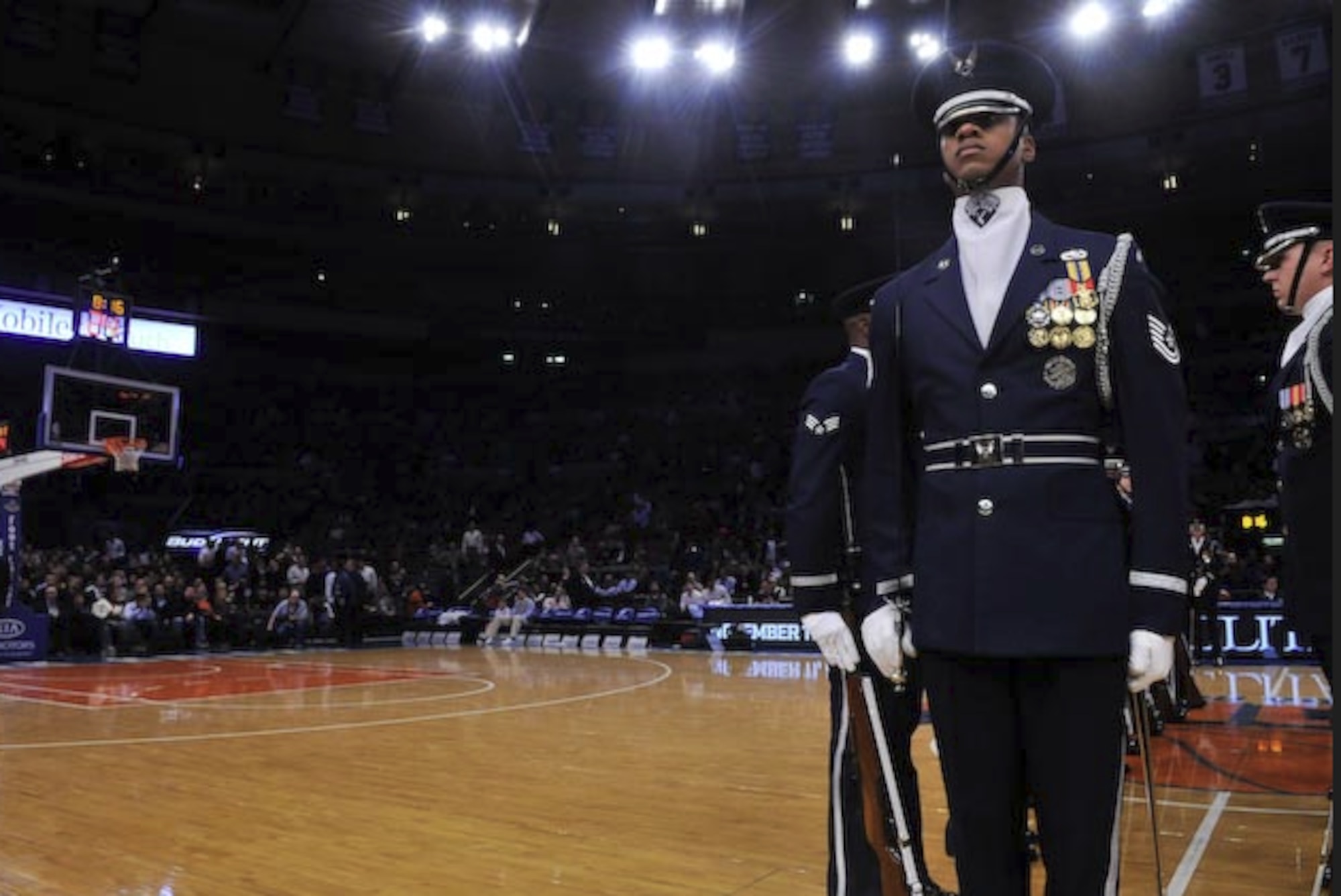 Then-Tech. Sgt. Robert B. Jones stands at attention with the Air Force Honor Guard Drill Team before a performance at Madison Square Garden on Military Appreciation Night in 2009. (U.S. Air Force photo)