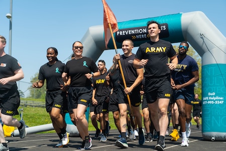 U.S. Army soldiers, assigned to 55th Signal Company (Combat Camera), participate in a suicide awareness walk event