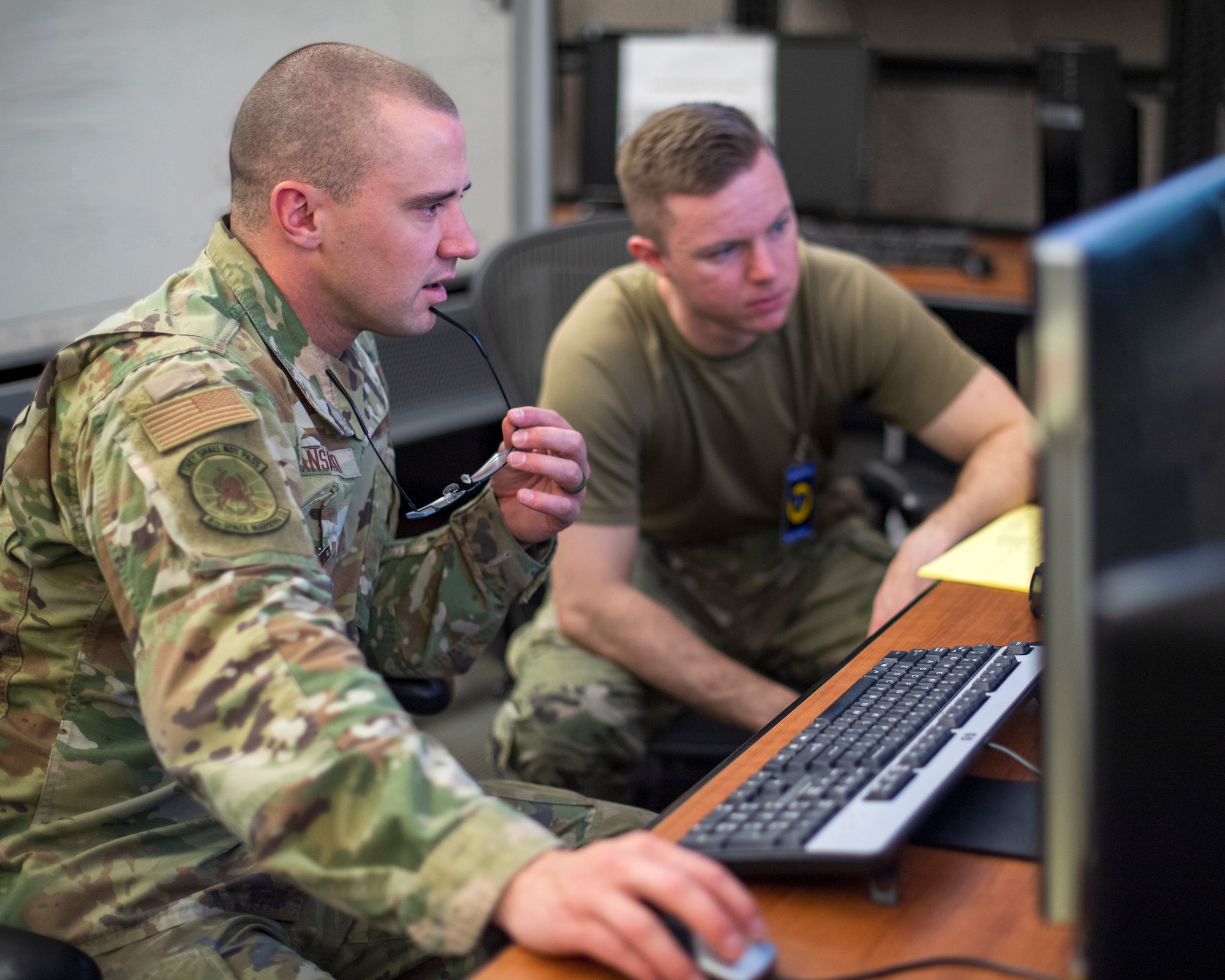U.S. service members work together during SPACE FLAG 23-2 at Schriever Space Force Base, Colorado, April 27, 2023. SPACE FLAG 23-2 was the largest exercise iteration to date, involving 250 participants. It was also the most complex integration of cyber warfare, the largest integration of coalition partners ever at a SPACE FLAG exercise, and the first SPACE FLAG exercise to feature live-fire space electronic warfare. (U.S. Space Force photo by Judi Tomich)