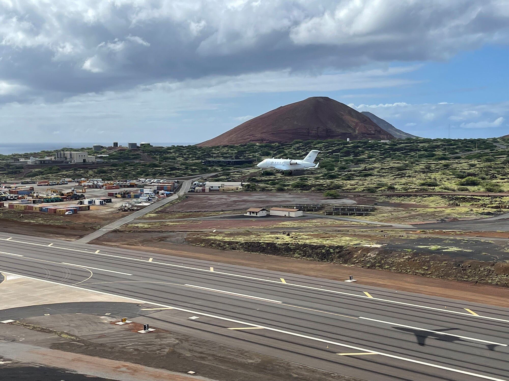 aircraft flies over center of new runway