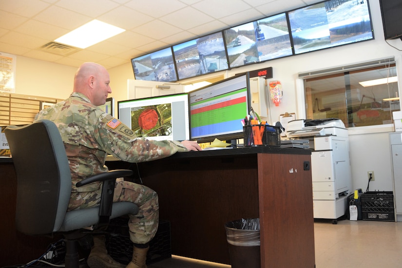 Sergeant 1st Class Josh Partner, Fires Desk noncommissioned officer in charge, mans the Fires Desk in Fort Indiantown Gap’s Range Operations building on April 13, 2023. (Pennsylvania National Guard photo by Brad Rhen)