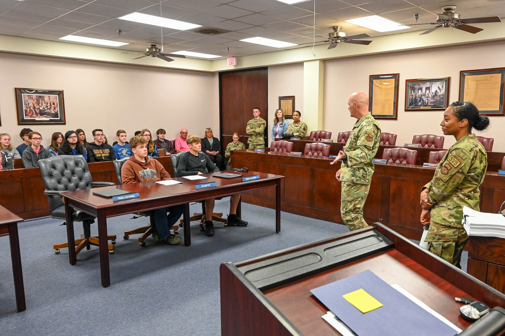 U.S. Air Force Col. Blaine Baker, 97th Air Mobility Wing commander, addresses students from Altus High School during a National Law Day mock trial at Altus Air Force Base (AFB), Oklahoma, May 1, 2023. Almost half of the students that participated in the mock trial had a connection to Altus AFB. (U.S. Air Force photo by Senior Airman Trenton Jancze)