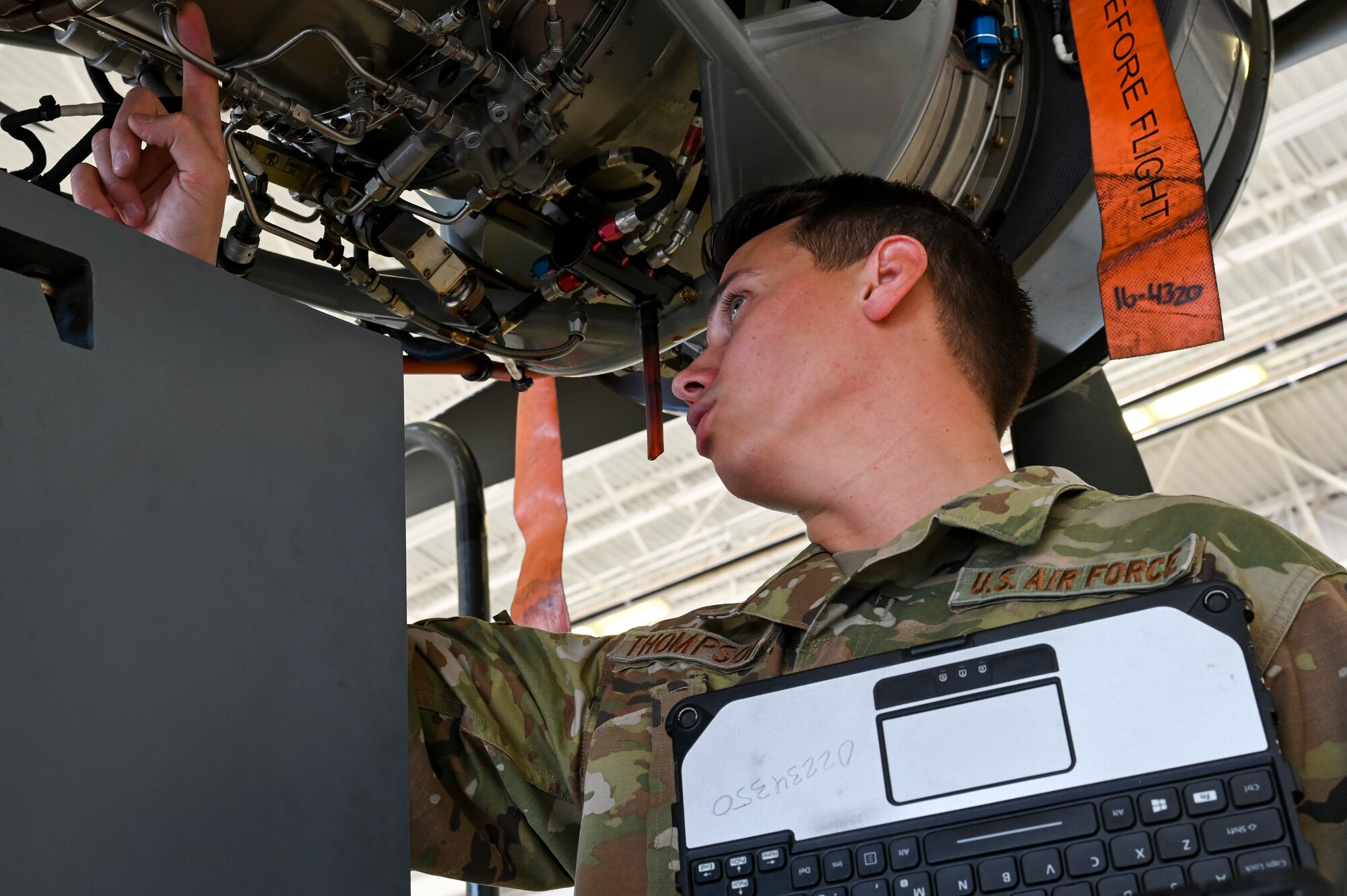 U.S. Air Force Senior Airman Alejandro Thompson, 29th Aircraft Maintenance Unit MQ-9 Reaper dedicated crew chief, inspects the engine of an MQ-9 at Holloman Air Force Base, New Mexico, May 2, 2023.