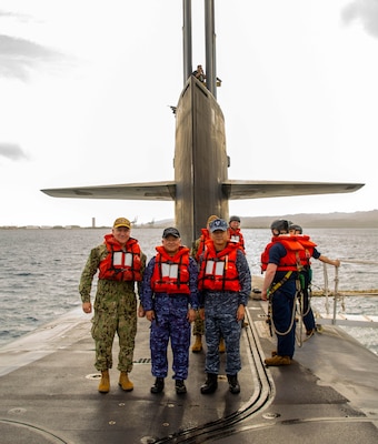 From left, U.S. Navy Rear Adm. Rick Seif, commander, Submarine Group 7; Japan Maritime Self-Defense Force Vice Adm. Tateki Tawara, commander, Fleet Submarine Force; and Republic of Korea (ROK) Navy Rear Adm. Su Youl Lee, commander, ROK Navy Submarine Force; pose for a photo aboard the Ohio-class ballistic missile submarine USS Maine (SSBN 741), April 18. During their time at sea aboard the submarine, the senior leaders were provided tours and demonstrations of the unit’s capabilities, which operates globally under U.S. Strategic Command.