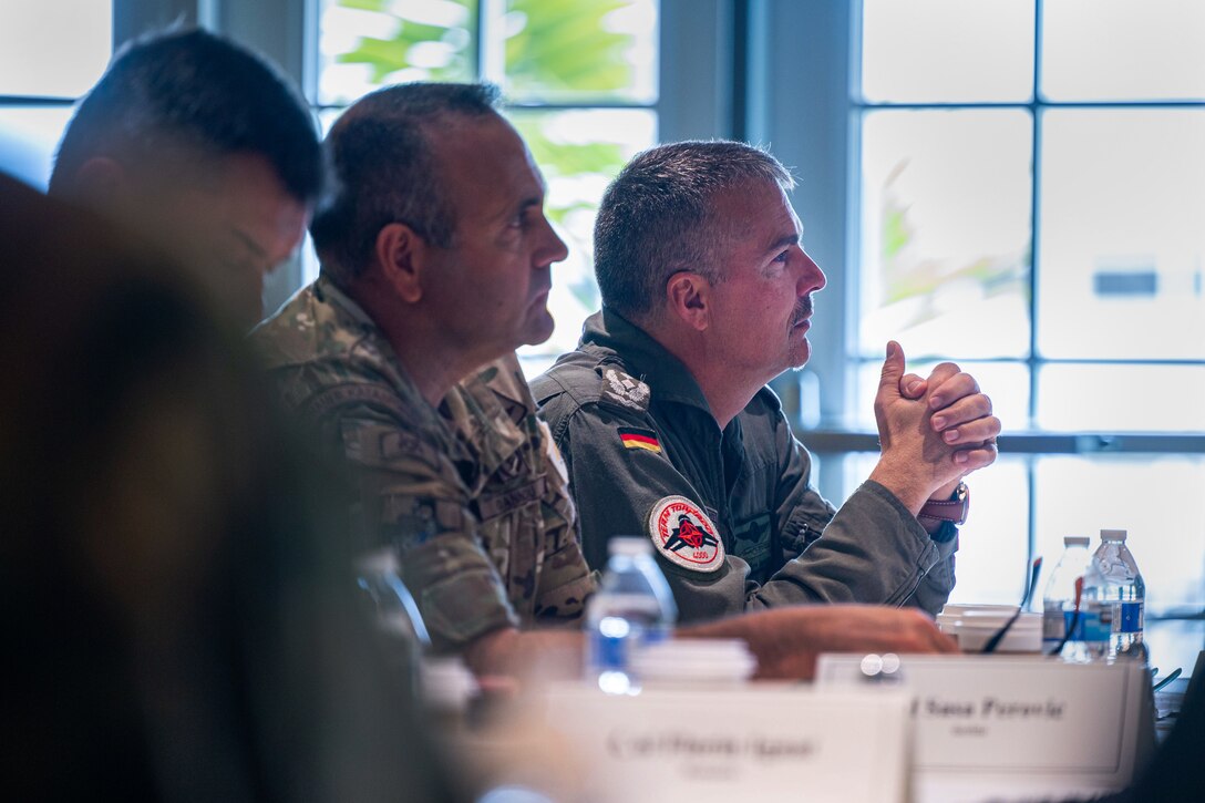 Senior ranking Foreign Air Attachés of a Secretary of the Air Force International Affairs (SAF/IA)-sponsored tour listen in during a Combined Space Operations Center mission brief at the Pacific Coast Club on Vandenberg Space Force Base, Calif., May 3, 2023. Hosted by the Combined Force Space Component Command, the group consisted of 15 Foreign Air Attachés, all from different countries, who participated in space-related discussions. (U.S. Space Force photo by Tech. Sgt. Luke Kitterman)