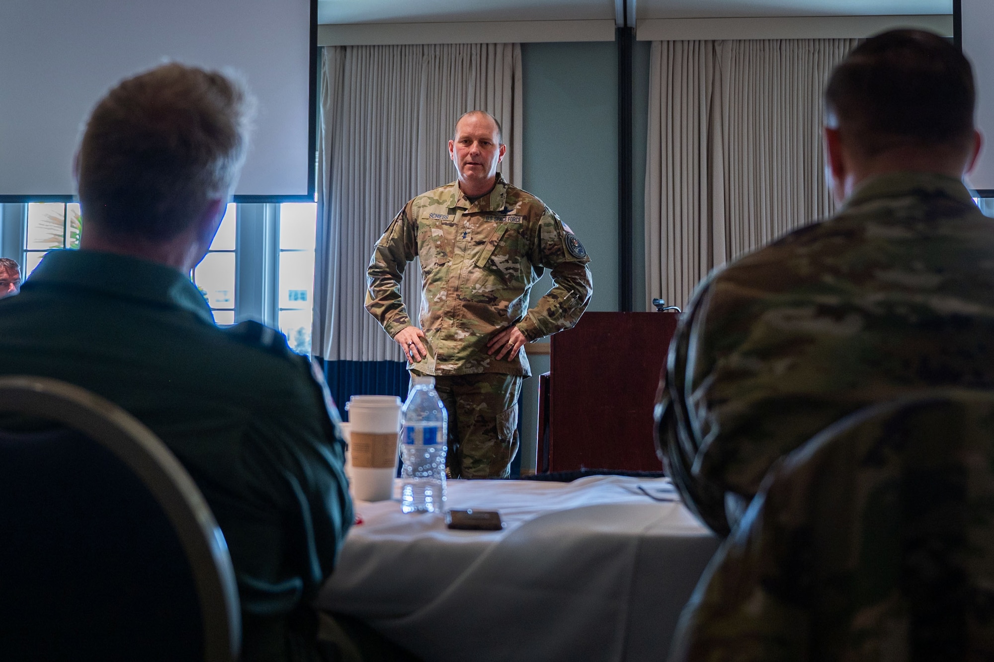 U.S. Space Force Maj. Gen. Douglas A. Schiess, Combined Force Space Component Command commander, middle, listens to a question from Royal Air Force Air Commodore Jez Attridge, U.K. Air and Space Attaché, left, and U.S. Air Force Maj. Gen. Julian C. Cheater, Assistant Deputy Under Secretary of the Air Force International Affairs (SAF/IA), during a Schiess’ SAF/IA-sponsored tour at Vandenberg Space Force Base, Calif., May 3, 2023. Hosted by CFSCC, the group consisted of 15 Foreign Air Attachés, all from different countries, who participated in space-related discussions. (U.S. Space Force photo by Tech. Sgt. Luke Kitterman)