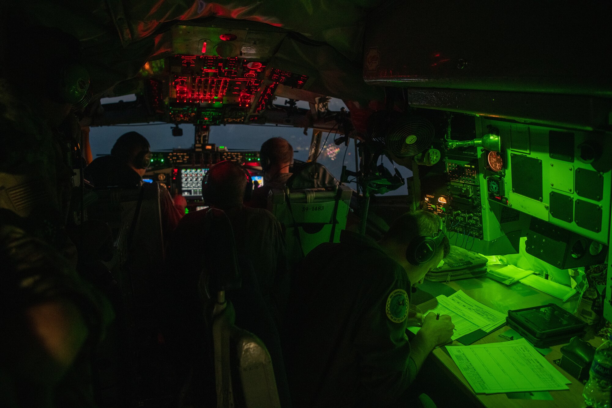 Airmen piloting and navigating a KC-135 Stratotanker assigned to the Ohio Air National Guard prepare for a night landing as part of Operation Hoodoo Sea over South Florida May 1, 2023. The exercise validated minimum force elements using multi-capable Airmen.