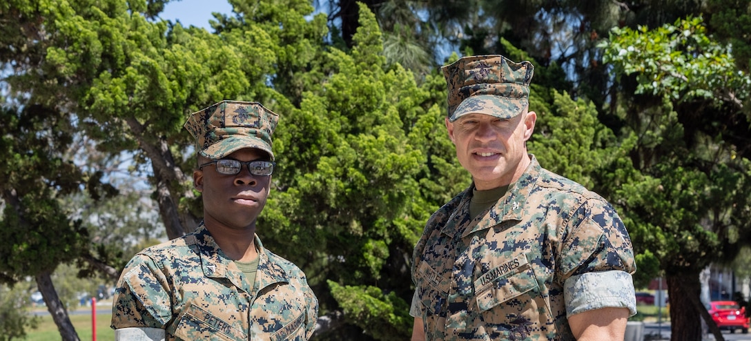 U.S. Marine Corps Lance Cpl. Joshua Peters, a Marine Corps Total Force System clerk with Service Company, Regional Disbursing Office - West, Marine Corps Base Camp Pendleton, and Col. Daniel Whitley, the assistant chief of staff of Government and External Affairs, with Marine Corps Installations -West, MCB Camp Pendleton, pose for a photo at the MCI-West headquarters on Camp Pendleton, California, April 29, 2023. Lance Cpl. Peters met with Col. Whitley to showcase leadership that can be capable at all levels of the chain, from small unit to flag officers. (U.S. Marine Corps photo by Sgt. Andrew Cortez)