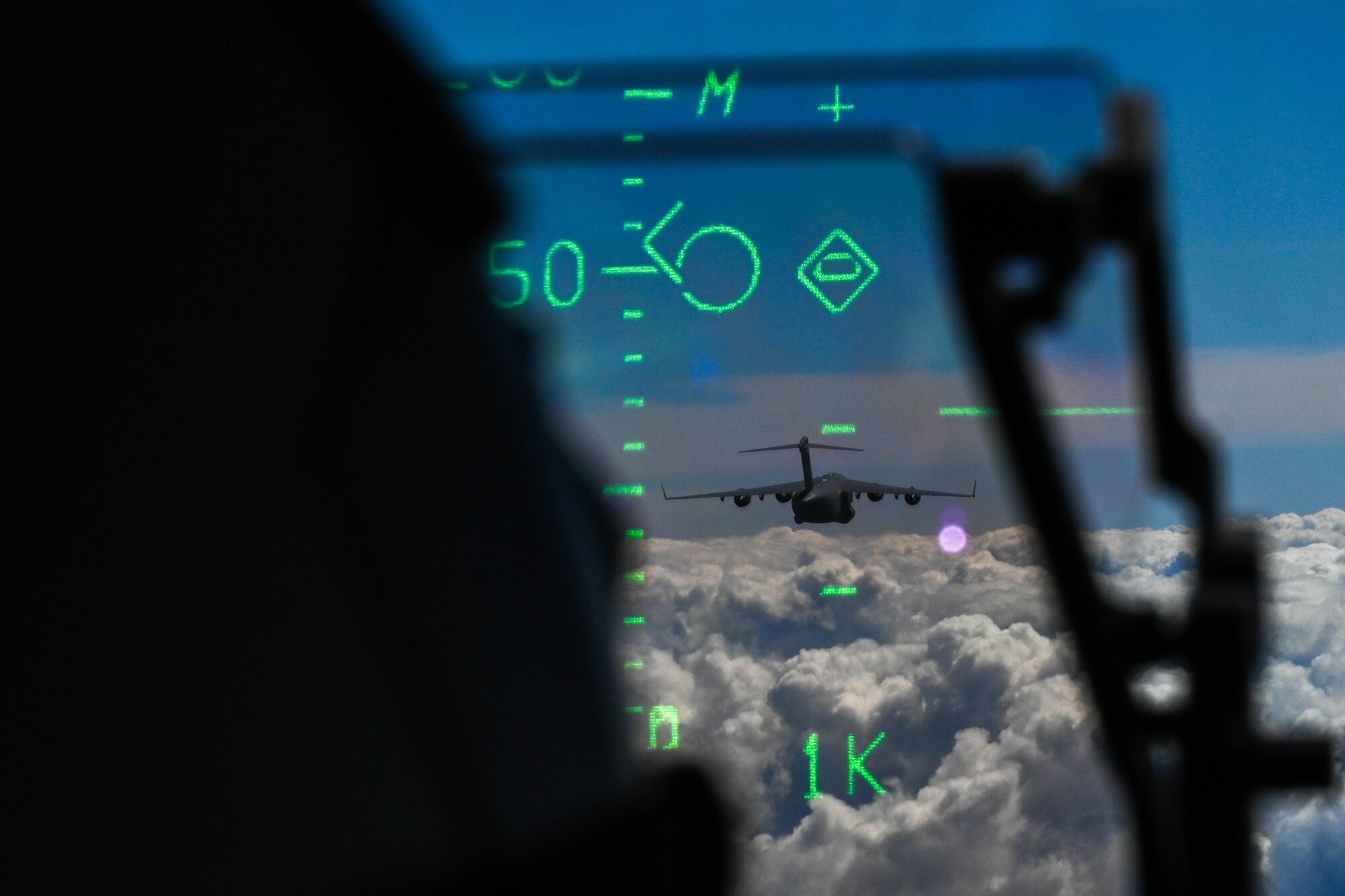 A Royal Australian Air Force C-17 Globemaster III flies in a two-ship formation during a training flight for Global Dexterity 23-1 at RAAF Base Amberley, Queensland, April 27, 2023. This exercise is designed to help develop the bilateral tactical airlift capabilities of the U.S. Air Force and the Royal Australian Air Force and learn from each other to strengthen partnerships in the Indo-Pacific region. (U.S. Air Force photo by Senior Airman Makensie Cooper)