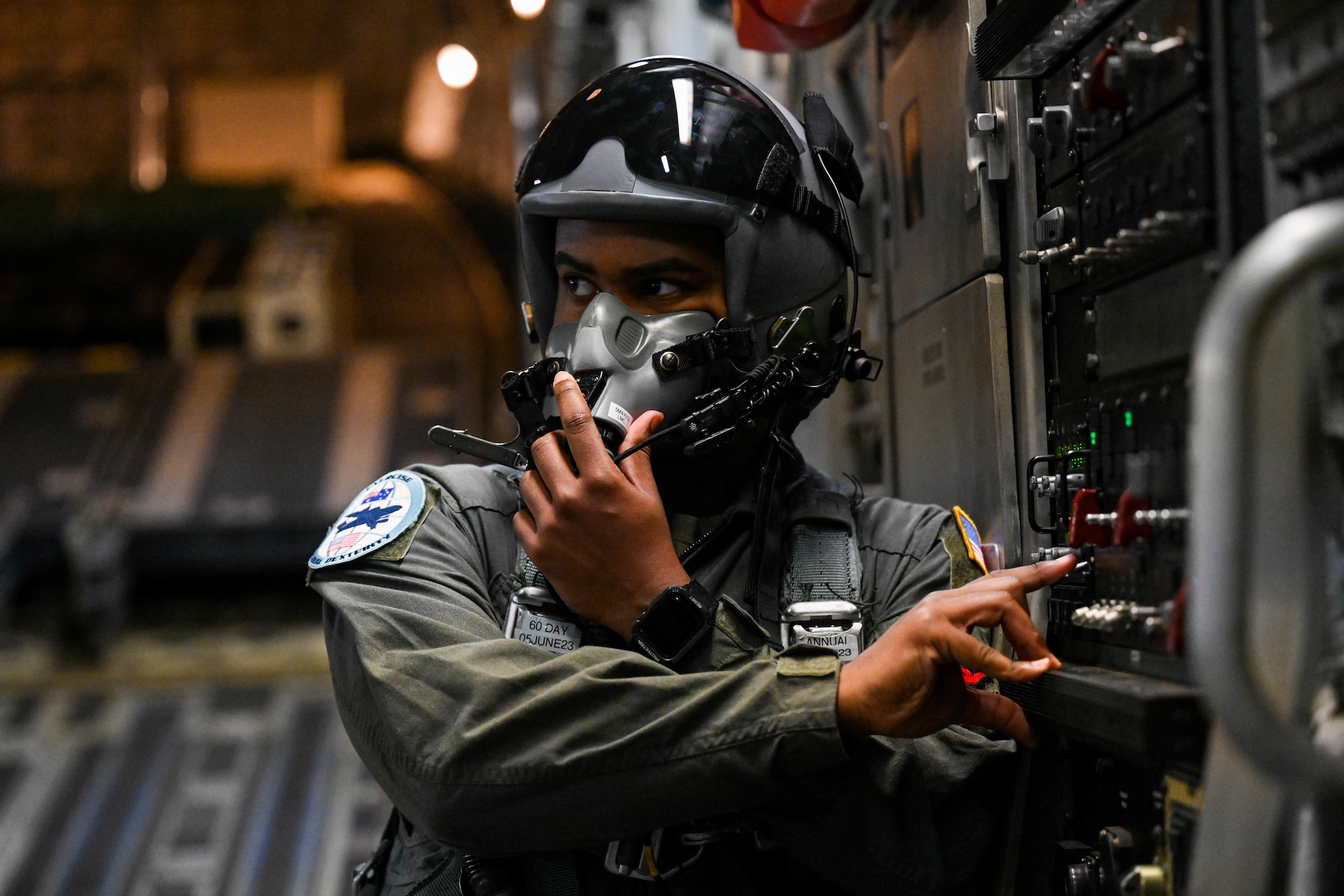 U.S. Air Force Senior Airman Jovanni Banuchi, 535th Airlift Squadron loadmaster, prepares for a high-altitude airdrop during a training flight during Global Dexterity 23-1, at Royal Australian Air Force Base Amberley, Queensland, April 27, 2023. This is the sixth iteration of Exercise Global Dexterity between the U.S. Air Force and our Indo-Pacific partners, the Royal Australian Air Force, and focuses on strengthening our military partnership in the region. (U.S. Air Force photo by Senior Airman Makensie Cooper)