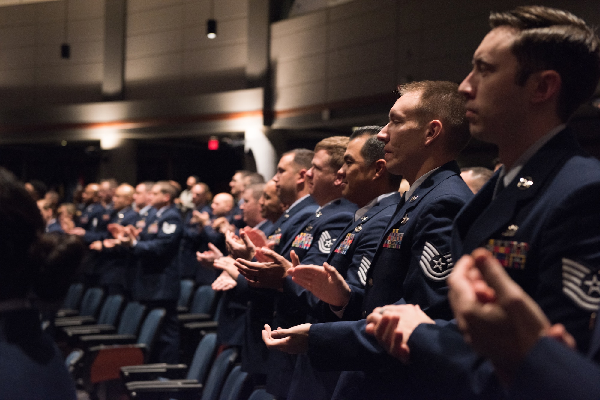 Air Force Noncommissioned Officer Academy students applaud during their graduation ceremony on Maxwell Air Force Base - Gunter Annex, Ala. The Gunter NCO Academy, which reopened in April 2019 to become the temporary home of the Airey NCO Academy after Hurricane Michael, is closing indefinitely once the current class graduates on May 12, 2023 (U.S. Air Force photo by Airman 1st Class Charles Welty)