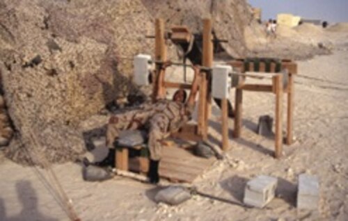Image of a service member using exercise equipment.