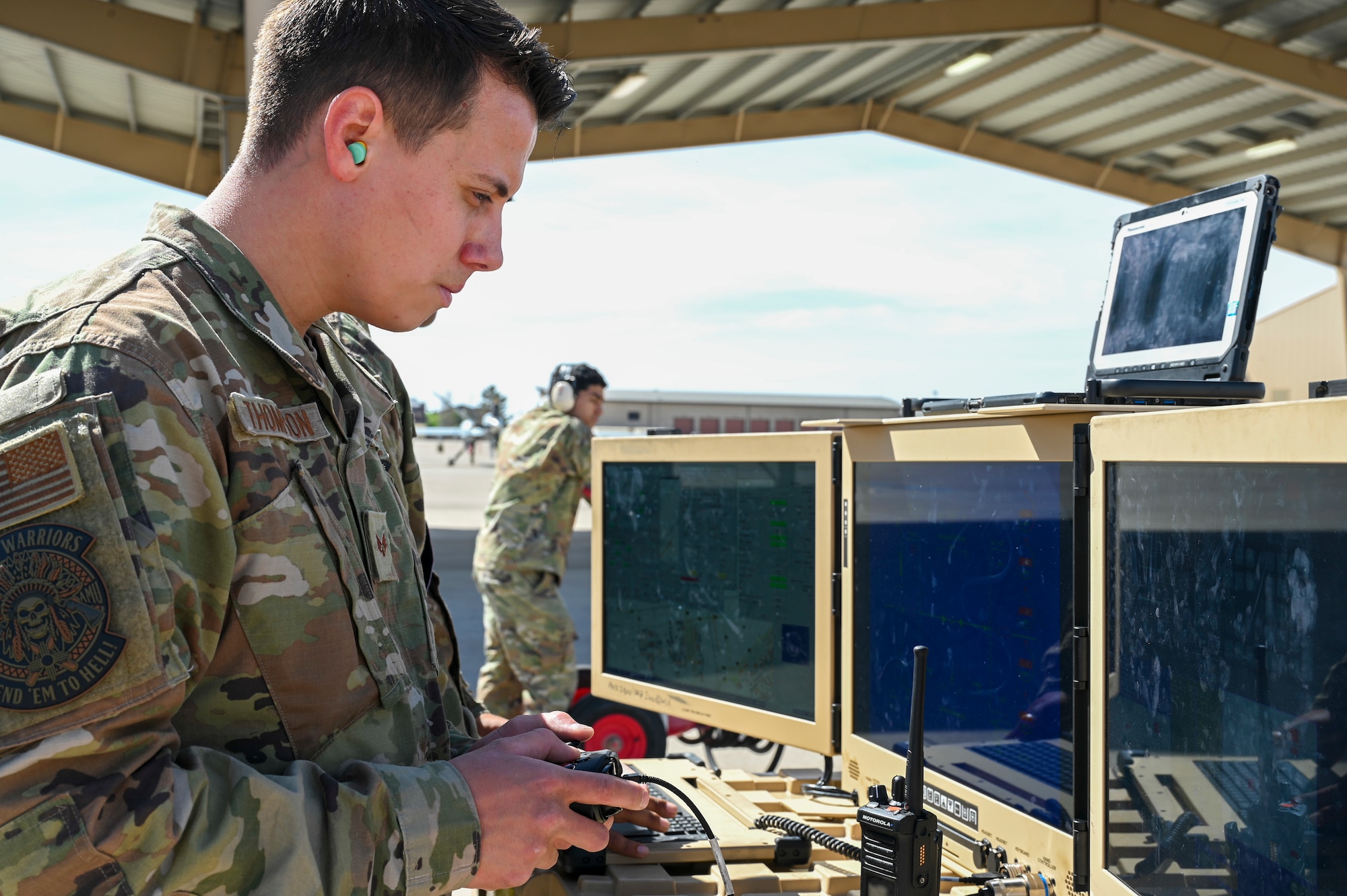 U.S. Air Force Senior Airman Alejandro Thompson, 29th Aircraft Maintenance Squadron MQ-9 Reaper dedicated crew chief, uses a portable aircraft control station at Holloman Air Force Base, New Mexico, May 3, 2023.