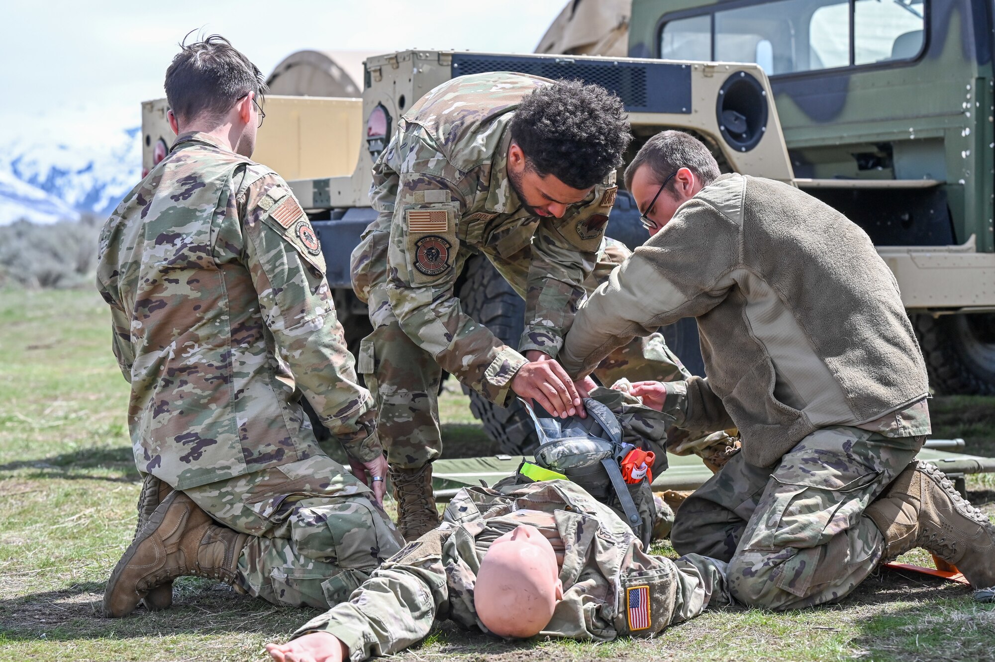 Airmen from 729th Air Control Squadron perform care-under-fire procedures during a Deployment Initial Readiness Training.
