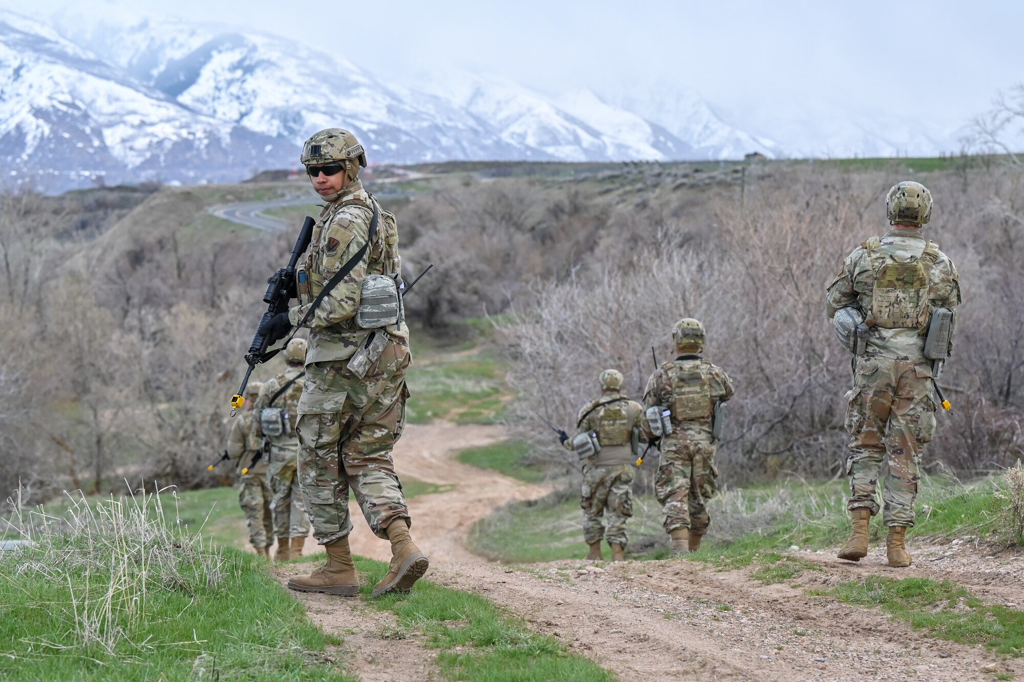 (Left) Airman 1st Class Oliver Walton-Williams, 729th Air Control Squadron, keeps lookout during a Deployment Initial Readiness Training course