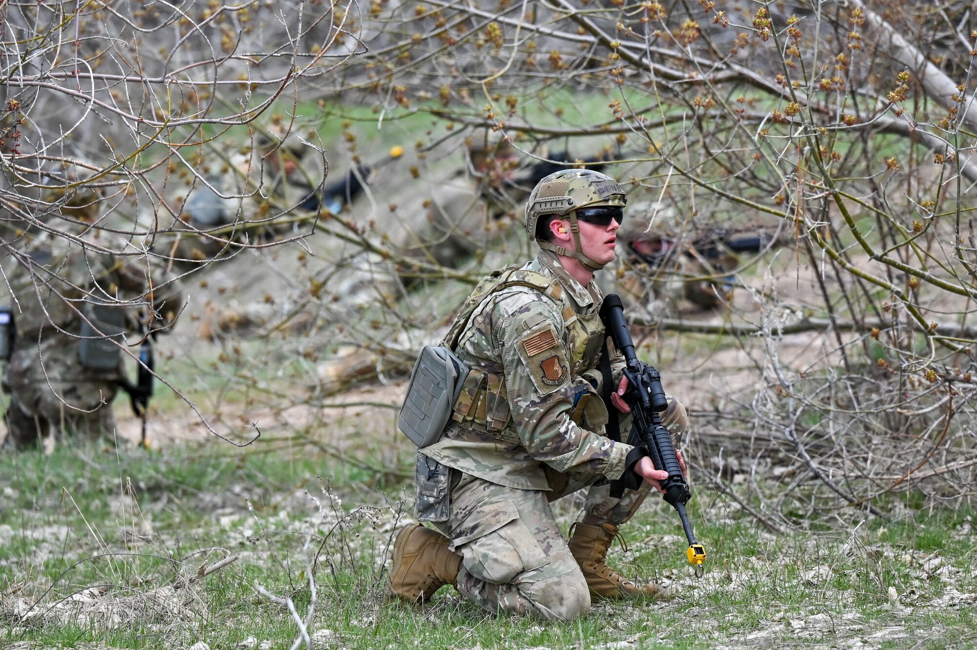 Senior Airman Brandon Parshall, 729th Air Control Squadron, sets up a defensive perimeter during a Deployment Initial Readiness Training course