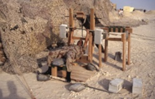 Image of a service member using exercise equipment.