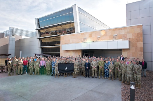  Members of the 392d Combat Training Squadron stand with SPACE FLAG 23-2 participants for a group photo at Schriever Space Force Base, Colorado, April 17, 2023. SPACE FLAG 23-2 was the largest exercise iteration to date, involving 250 participants. It was also the most complex integration of cyber warfare, the largest integration of coalition partners ever at a SPACE FLAG exercise, and the first SPACE FLAG exercise to feature live-fire space electronic warfare. (U.S. Space Force photo by Judi Tomich)