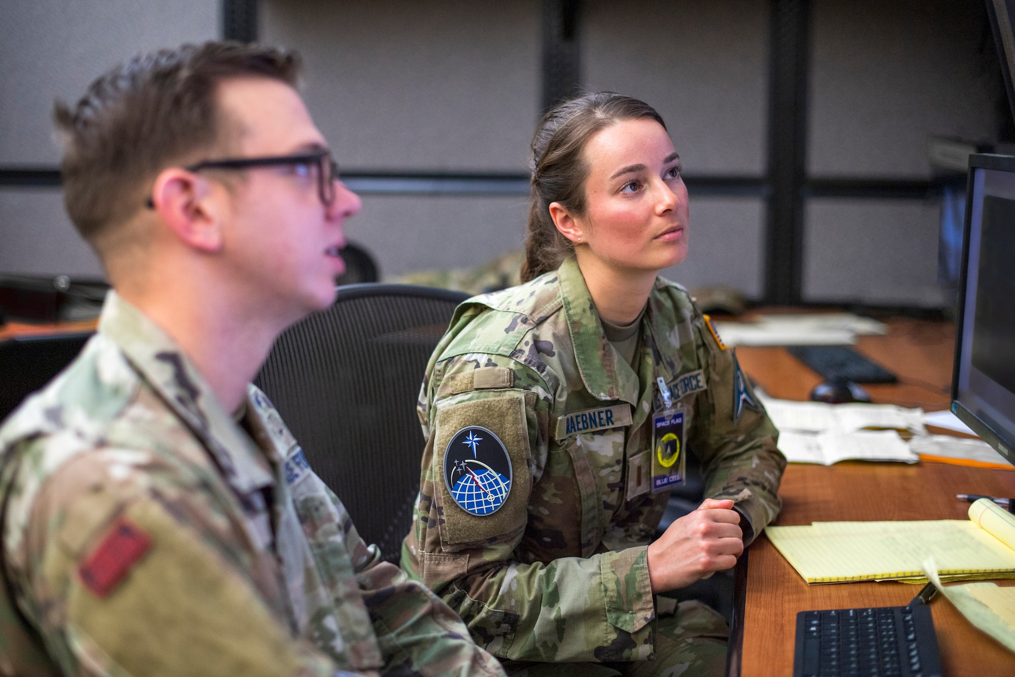 U.S. Space Force Guardians work together during SPACE FLAG 23-2 at Schriever Space Force Base, Colorado, April 27, 2023. SPACE FLAG 23-2 was the largest exercise iteration to date, involving 250 participants. It was also the most complex integration of cyber warfare, the largest integration of coalition partners ever at a SPACE FLAG exercise, and the first SPACE FLAG exercise to feature live-fire space electronic warfare. (U.S. Space Force photo by Judi Tomich)