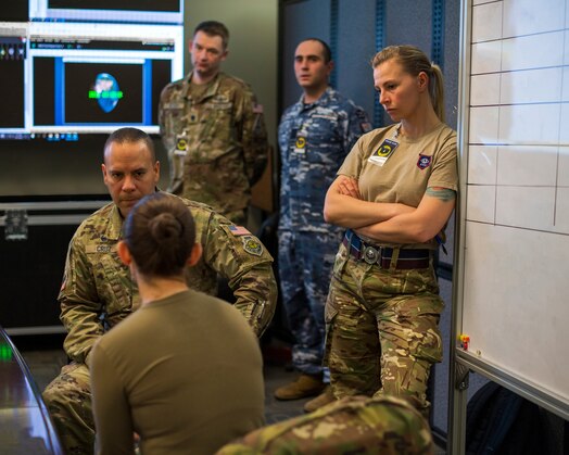  SPACE FLAG 23-2 participants brief U.S. Space Force Col. Miguel Cruz, Delta 4 commander, during the large force training exercise at Schriever Space Force Base, Colorado, April 27, 2023. SPACE FLAG 23-2 was the largest exercise iteration to date, involving 250 participants. It was also the most complex integration of cyber warfare, the largest integration of coalition partners ever at a SPACE FLAG exercise, and the first SPACE FLAG exercise to feature live-fire space electronic warfare. (U.S. Space Force photo by Judi Tomich)