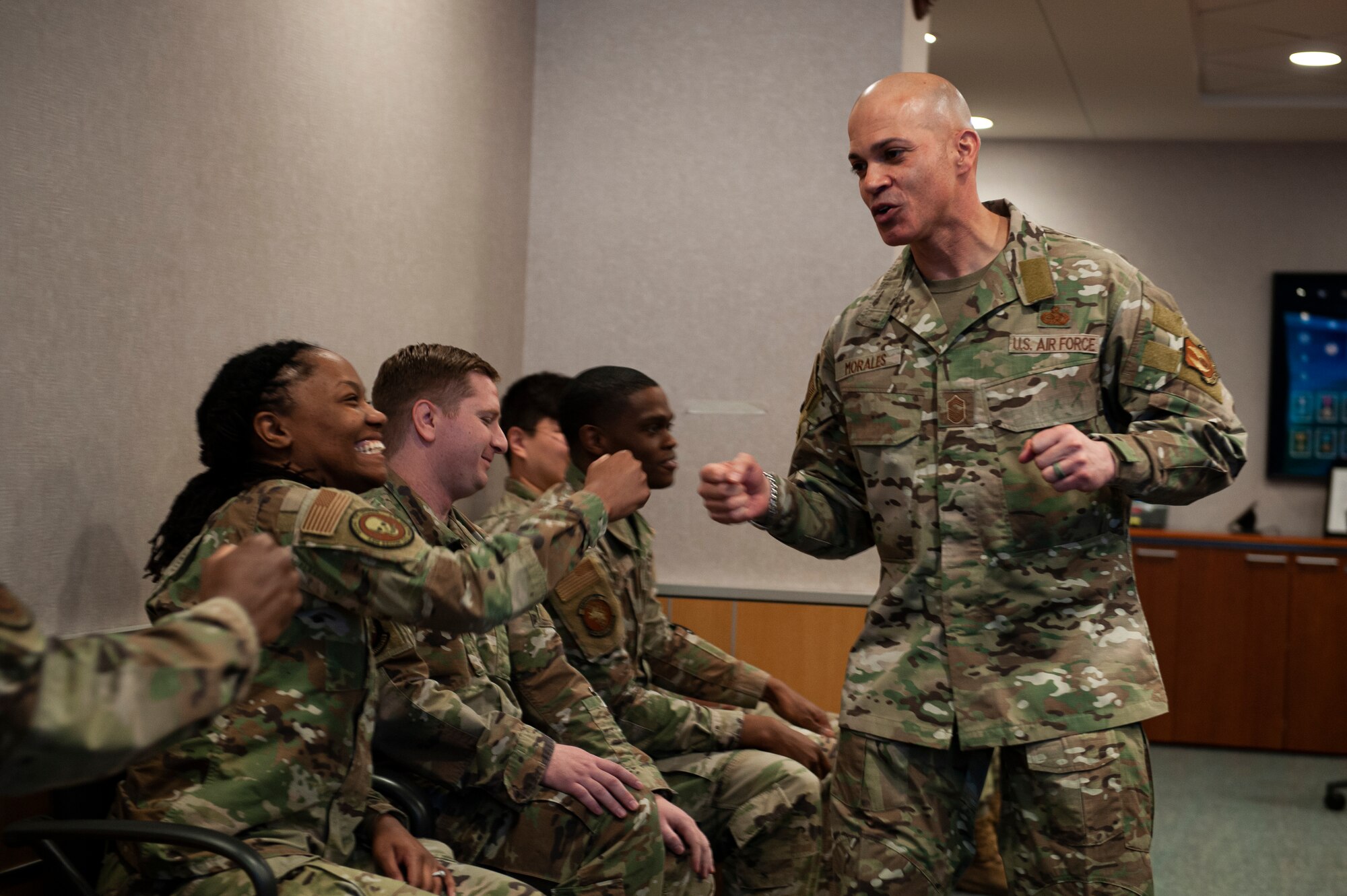 Chief Master Sgt. Lloyd Morales, 88th Air Base Wing command chief, greets Airmen from the National Air and Space Intelligence Center during his immersion visit to the center, Wright-Patterson Air Force Base, Ohio, April 10, 2023. During Morales’ tour of the Center, he received multiple briefings from different units showcasing their specific capabilities.