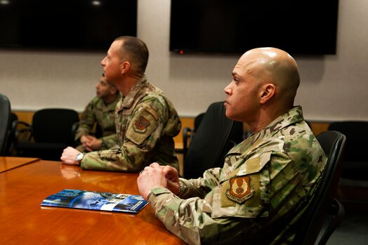  Chief Master Sgt. Lloyd Morales (right), 88th Air Base Wing command chief, and Chief Master Sgt. Carlos Labrador, National Air and Space Intelligence Center command chief, listen to a briefing from NASIC personnel brief their capabilities at Wright-Patterson Air Force Base, Ohio, April 10, 2023. During Morales’ visit to NASIC, he toured the facility and spoke with many Airmen and Guardians to better understand the unique mission sets that exist at NASIC.