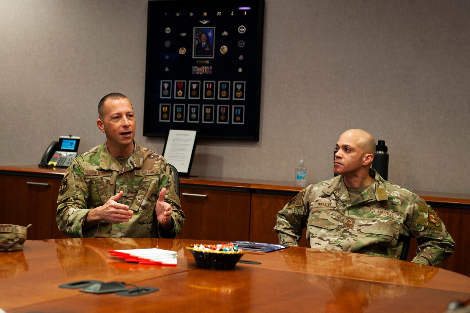 Chief Master Sgt. Carlos Labrador, National Air and Space Intelligence Center command chief, welcomes Chief Master Sgt. Lloyd Morales, 88th Air Base Wing command chief, at the kickoff of his immersion tour here, Wright-Patterson Air Force Base, Ohio, April 10, 2023. Visits such as this one, help bolster the already strong relationship NASIC has with the 88th ABW.