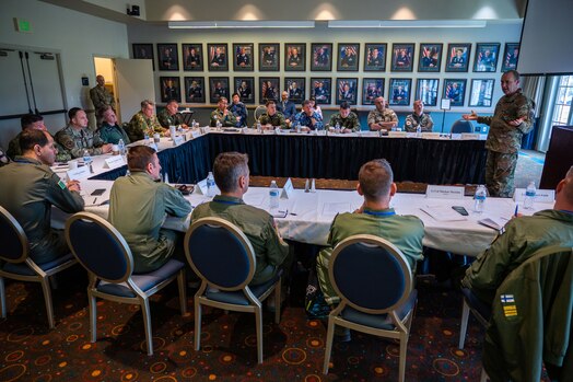  U.S. Space Force Maj. Gen. Douglas A. Schiess, Combined Force Space Component Command (CFSCC) commander, right, discusses space-related topics with 15 senior-ranking Foreign Air Attachés during a Secretary of the Air Force International Affairs (SAF/IA)-sponsored tour at Vandenberg Space Force Base, Calif., May 3, 2023. Led by U.S. Air Force Maj. Gen. Julian C. Cheater, Assistant Deputy Under SAF/IA, this DoD-level program aims to orient Attachés to DoD organizations and provide strategic messaging to senior foreign leaders, and is executed on behalf of the USAF Chief of Staff Gen. Charles Q. Brown. (U.S. Space Force photo by Tech. Sgt. Luke Kitterman)