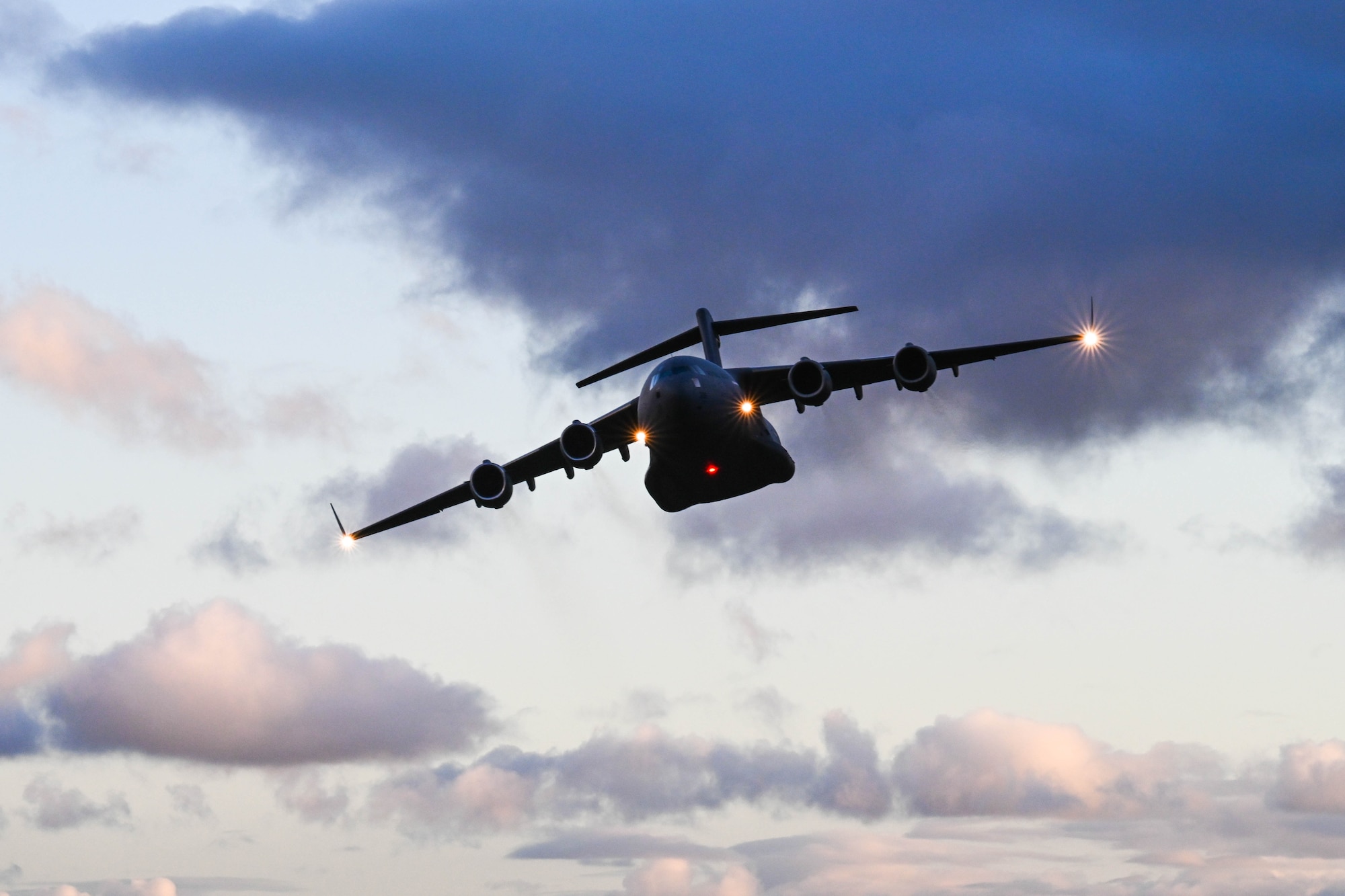 A Royal Australian Air Force C-17 Globemaster III flies in a two-ship formation during a training flight for Global Dexterity 23-1 in the skies of Australia, April 27, 2023. Exercise Global Dexterity 2023 is being conducted at RAAF Base Amberley, and is designed to help enhance air cooperation between the U.S. and Australia and increase our combined capabilities, improving security and stability in the Indo-Pacific region. (U.S. Air Force photo by Senior Airman Makensie Cooper)