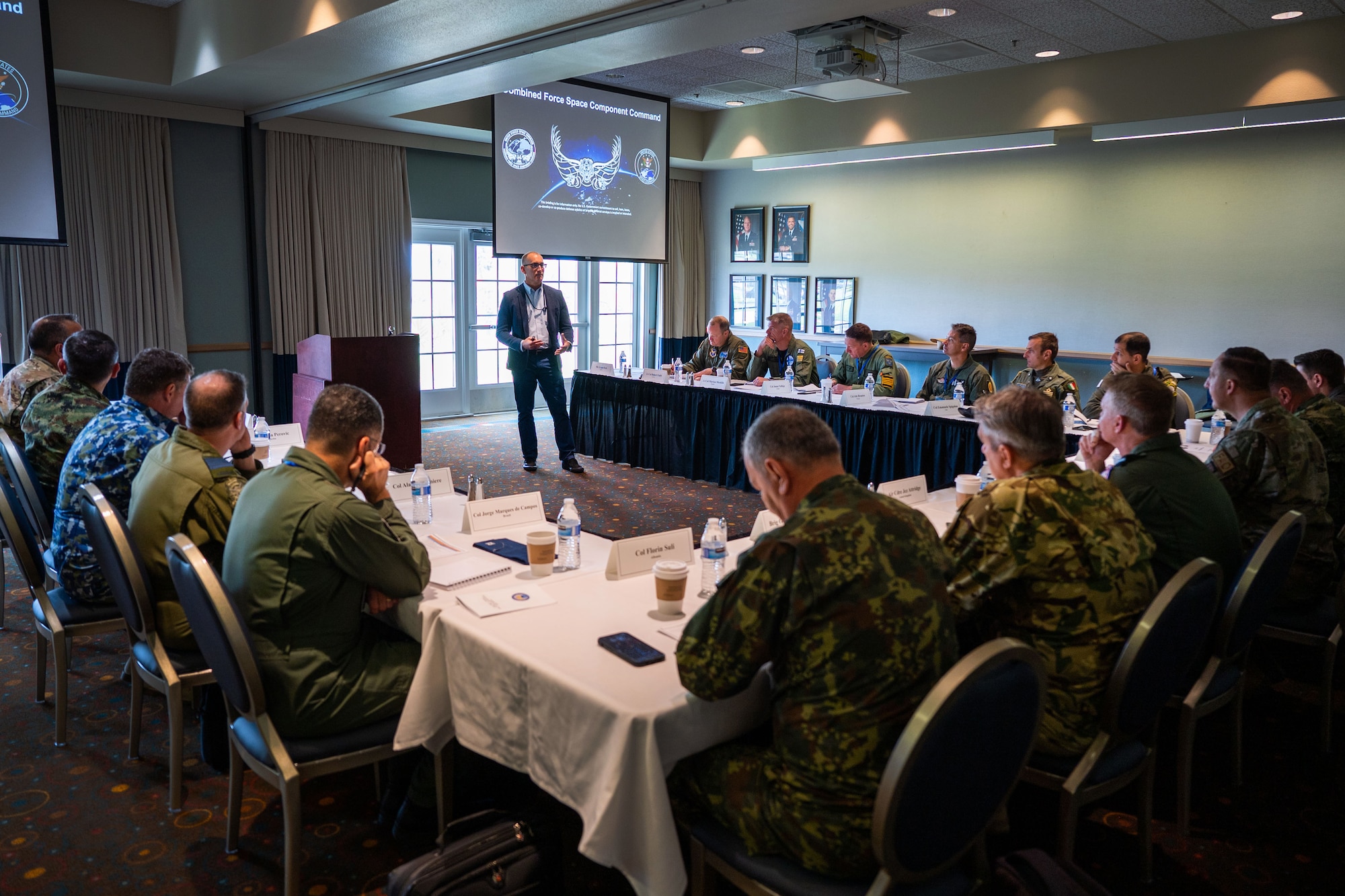 Mr. William P. Thompson, Combined Force Space Component Command (CFSCC) deputy chief of staff, leads a CFSCC mission brief to Foreign Air Attachés at the Pacific Coast Club on Vandenberg Space Force Base, Calif., May 3, 2023. Hosted by CFSCC, the group was part of a Secretary of the Air Force International Affairs (SAF/IA)-sponsored tour for D.C.-based Foreign Air Attachés from 15 different countries. Led by U.S. Air Force Maj. Gen. Julian C. Cheater, Assistant Deputy Under SAF/IA, this DoD-level program aims to orient Attachés to DoD organizations and provide strategic messaging to senior foreign leaders, and is executed on behalf of the USAF Chief of Staff Gen. Charles Q. Brown. (U.S. Space Force photo by Tech. Sgt. Luke Kitterman)